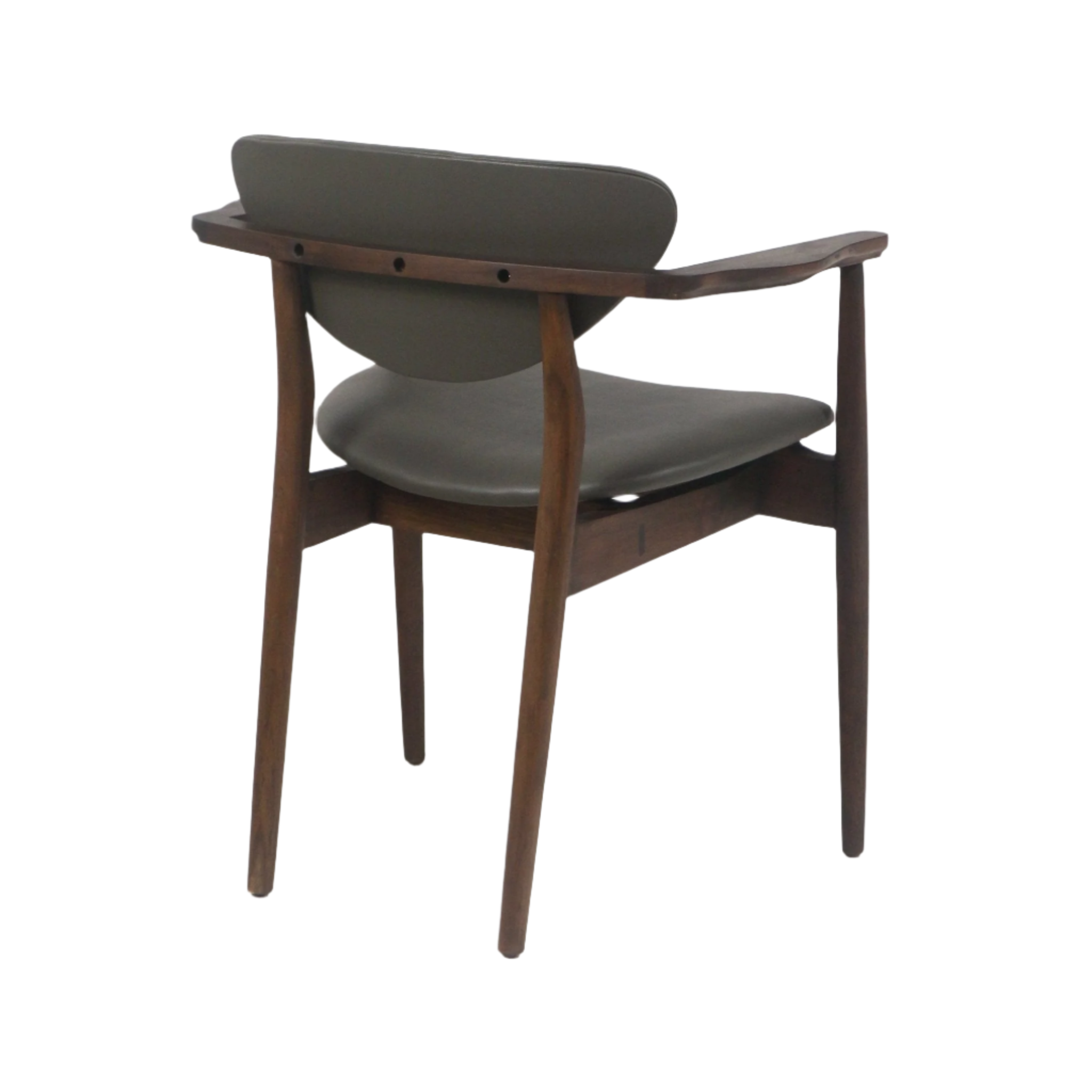 Rear three-quarter view of a mid-century modern dining chair with a teak wood frame, tapered legs and curved armrests, upholstered in dark gray leather on the seat and back.