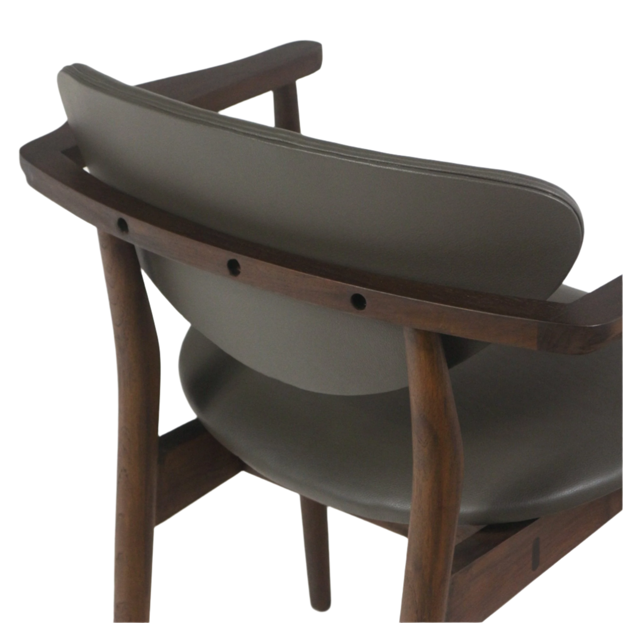 Close-up of a mid-century modern dining chair showing a curved teak frame with walnut finish, open armrests and cushioned gray leather backrest and seat.