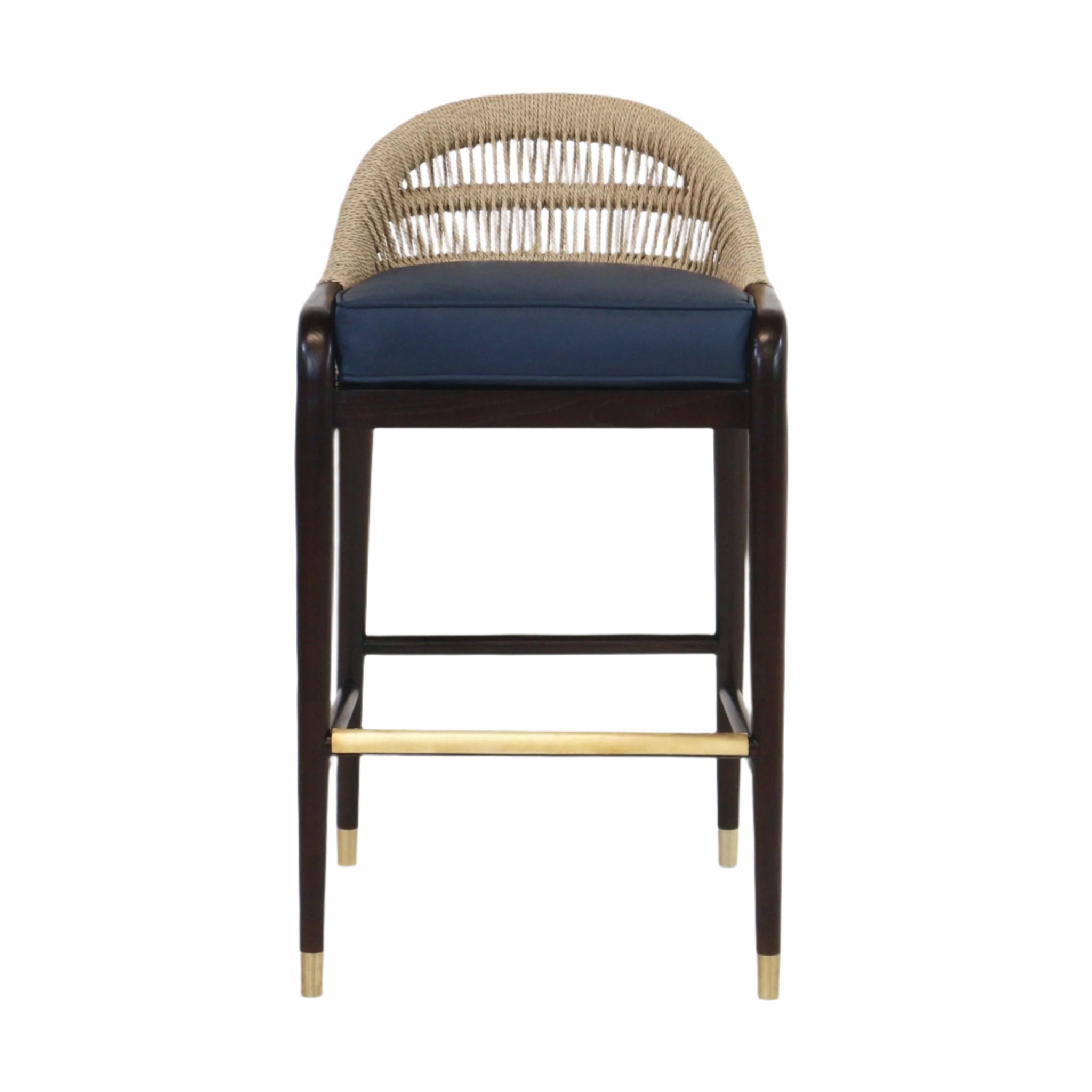 Front view of a teak-framed bar stool with a natural rope-woven back, navy blue upholstered leather seat, dark stained legs, and a brass footrest with brass-capped feet.