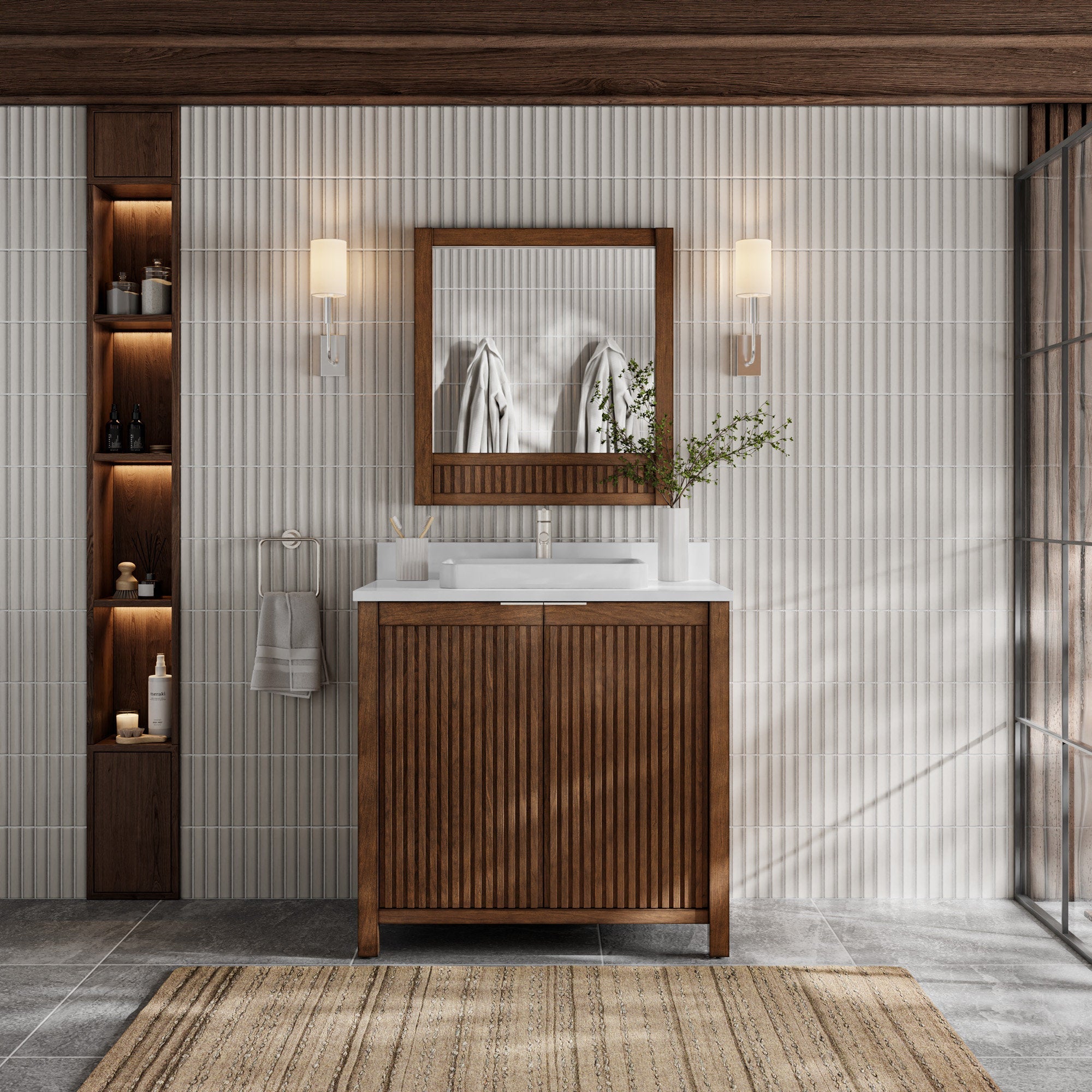 Modern solid-wood fluted bathroom vanity with stone top and single rectangular ceramic sink, matching wood-framed mirror, twin wall sconces, recessed illuminated shelving and towel ring.
