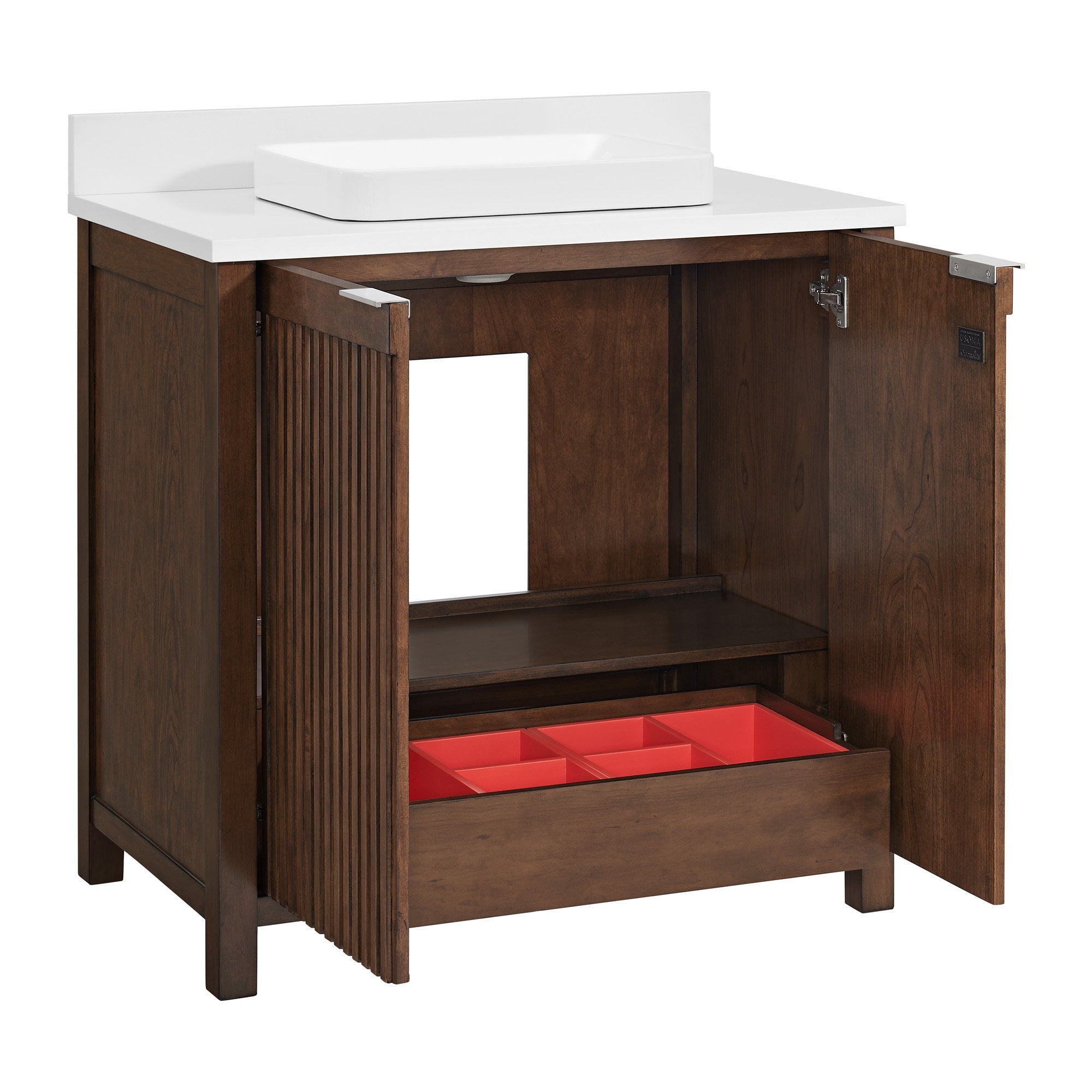 Freestanding single-sink bathroom vanity in dark natural wood with a white stone top and rectangular vessel sink, fluted door panel, interior plumbing cutout, shelf and lower drawer with red storage dividers.