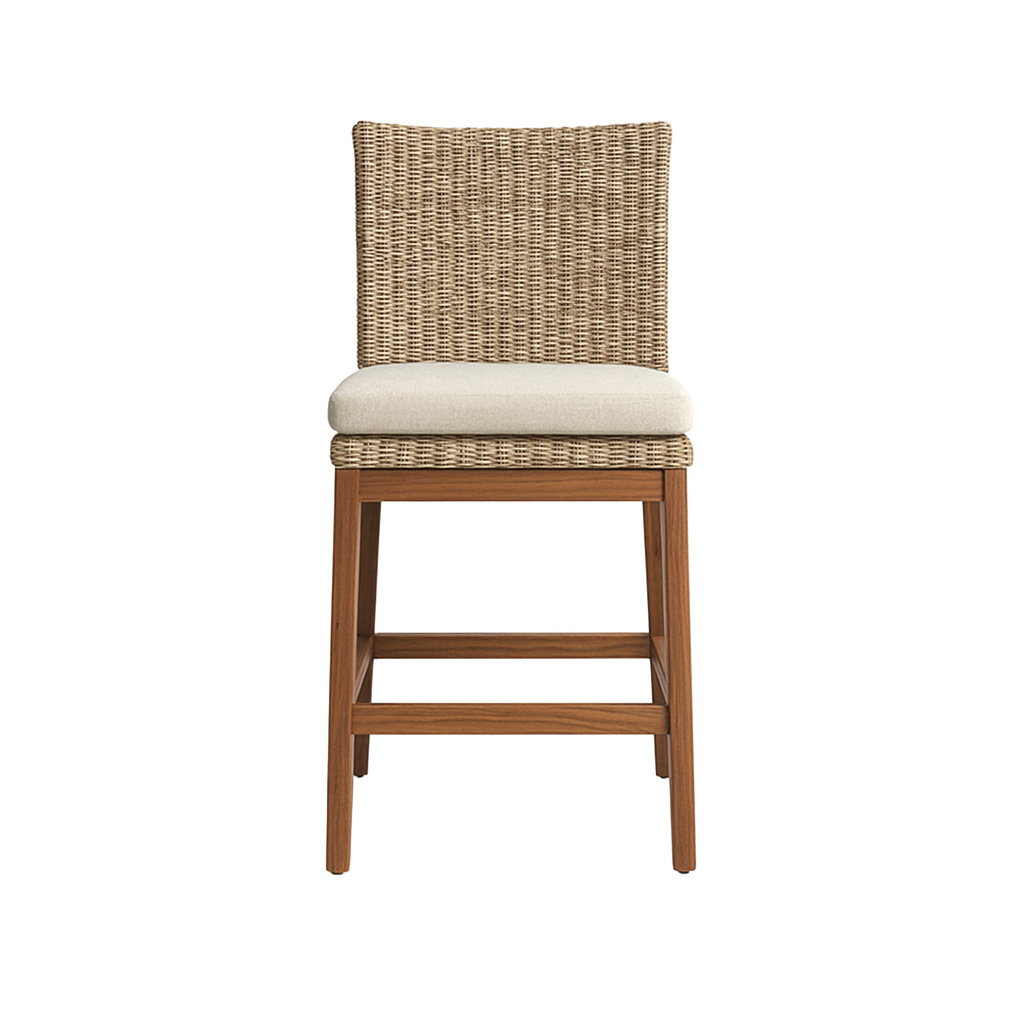 Front-facing armless outdoor bar stool with a teak wood frame and legs, woven natural wicker back and seat surround, and a beige fabric cushion, shown on a white background.