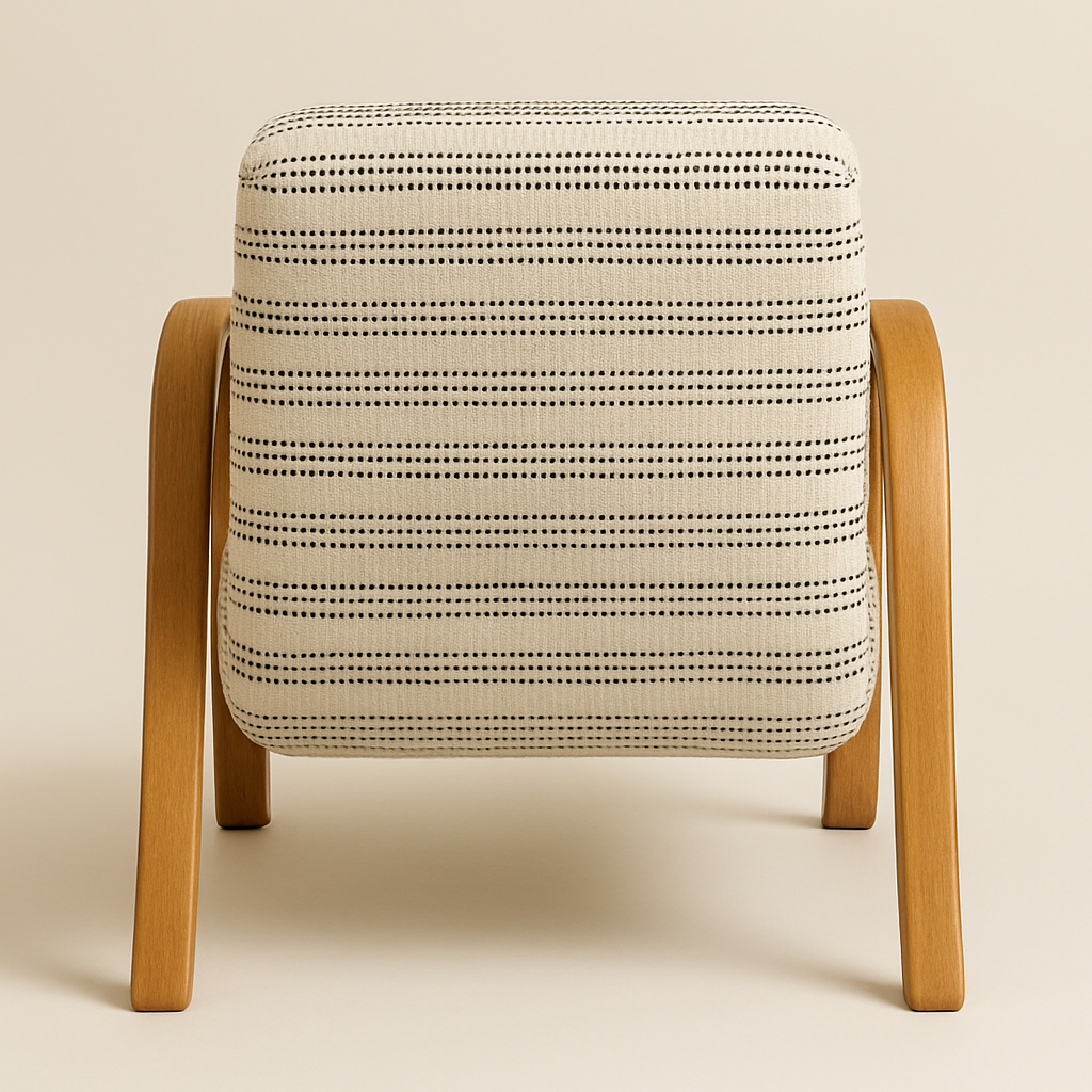 Rear view of a coastal-style accent chair with cream canvas upholstery featuring thin dotted black horizontal stripes and a curved natural oak frame with rounded legs.