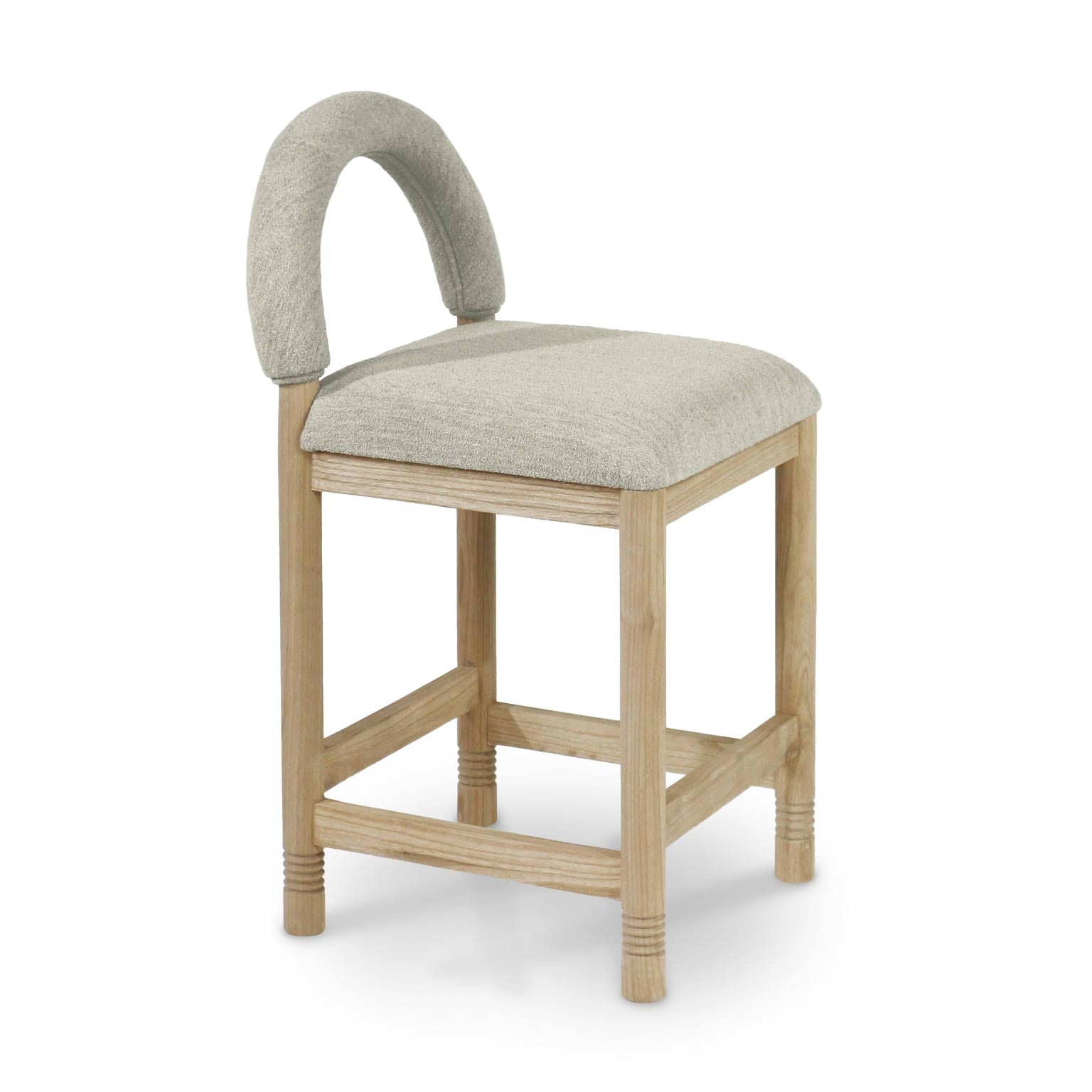 Natural oak-framed counter stool with beige taupe boucle upholstered seat and short arched back, square padded seat, four legs with stretchers and subtle turned rings at the feet, shown on a white background.