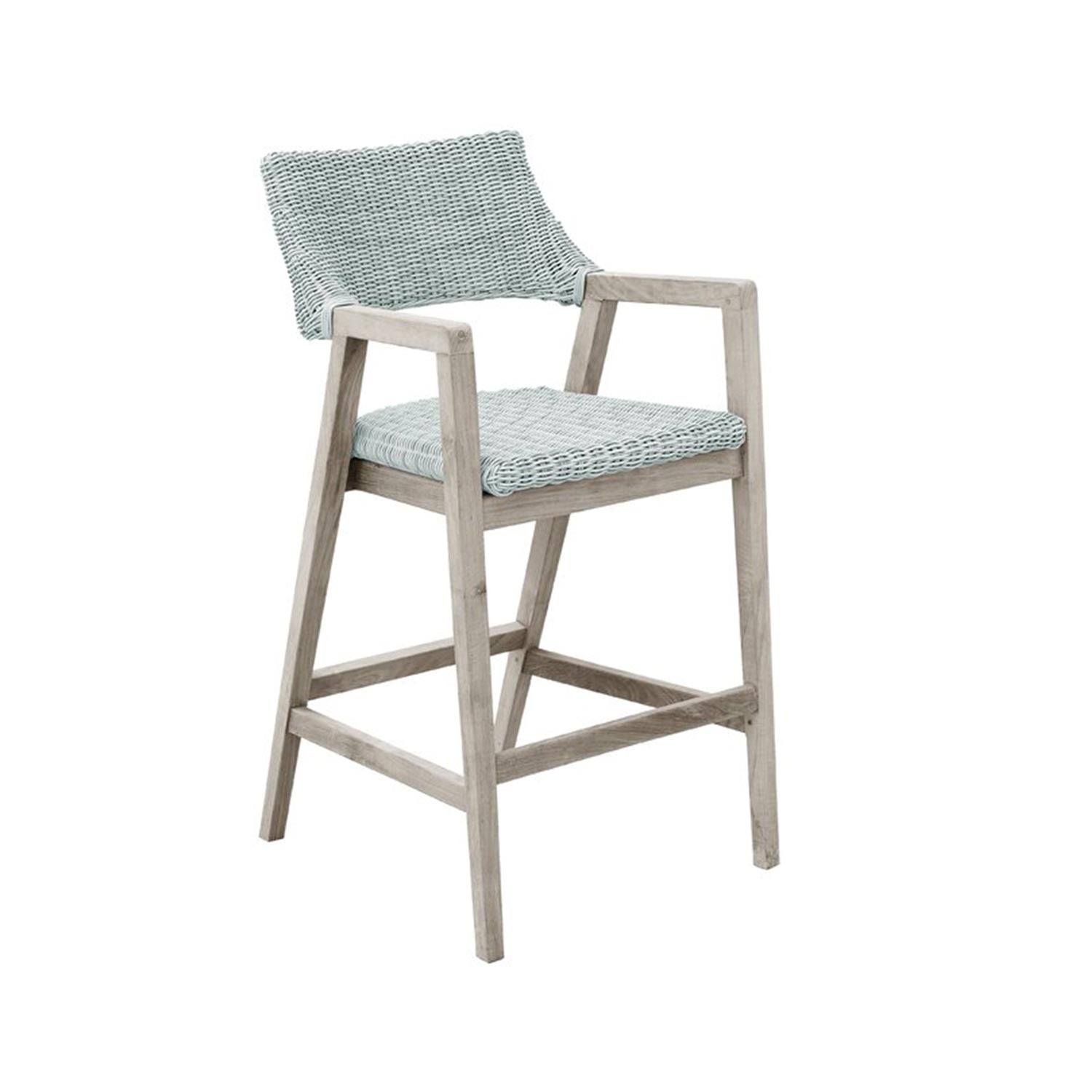 Natural teak-framed outdoor bar stool with pale-gray woven rope seat and back, integrated armrests and square footrest in a coastal style.