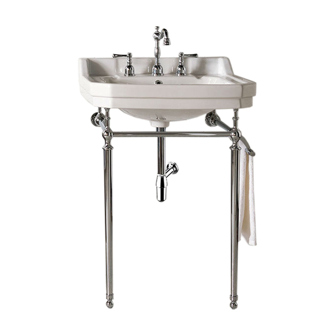 White ceramic single-bowl console sink on polished chrome metal legs with exposed drain and three-piece chrome faucet, featuring an integrated towel bar holding a white towel — freestanding modern bathroom vanity.