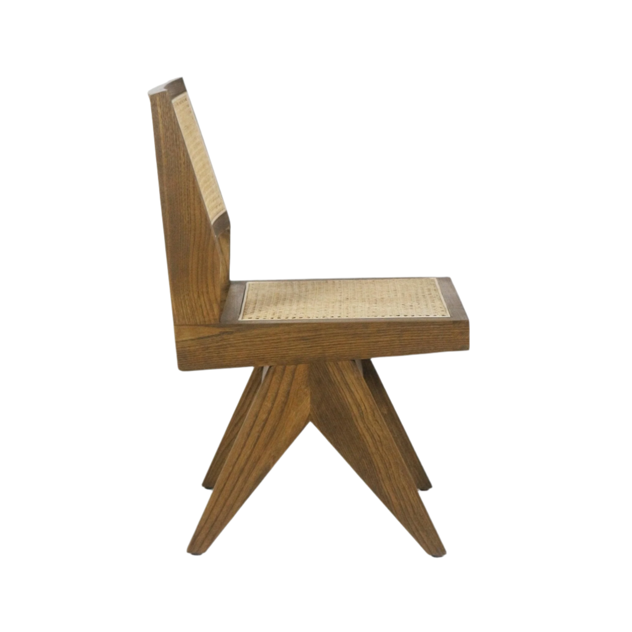 Side profile of a midcentury armless dining chair with warm teak-toned solid wood frame, woven cane seat and back, and sculpted splayed legs.