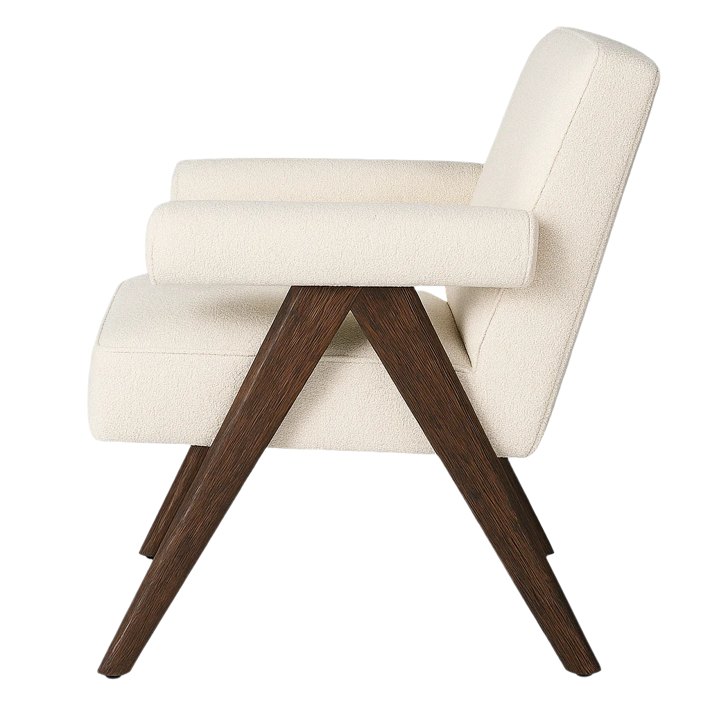 Side profile of a cream boucle upholstered accent chair with rounded armrests and a slanted full back, supported by dark natural wood A-frame legs in a mid-century modern silhouette.