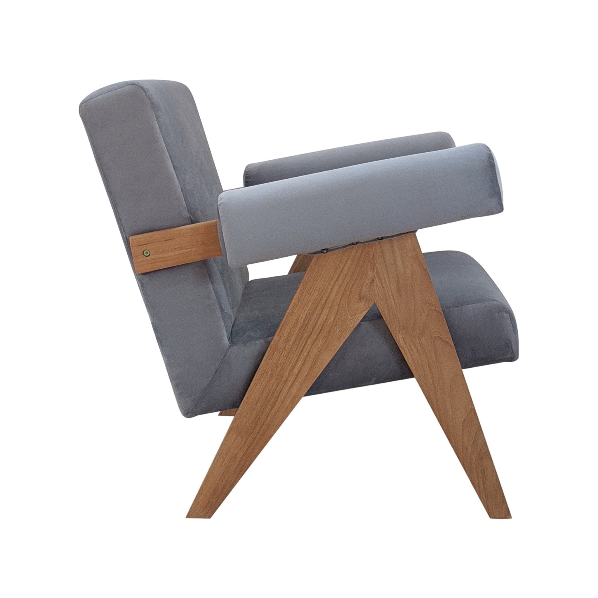 Side profile of a midcentury modern accent chair upholstered in gray fabric with padded rectangular arms and cushions, supported by angled natural wood legs forming a sculptural A-frame.