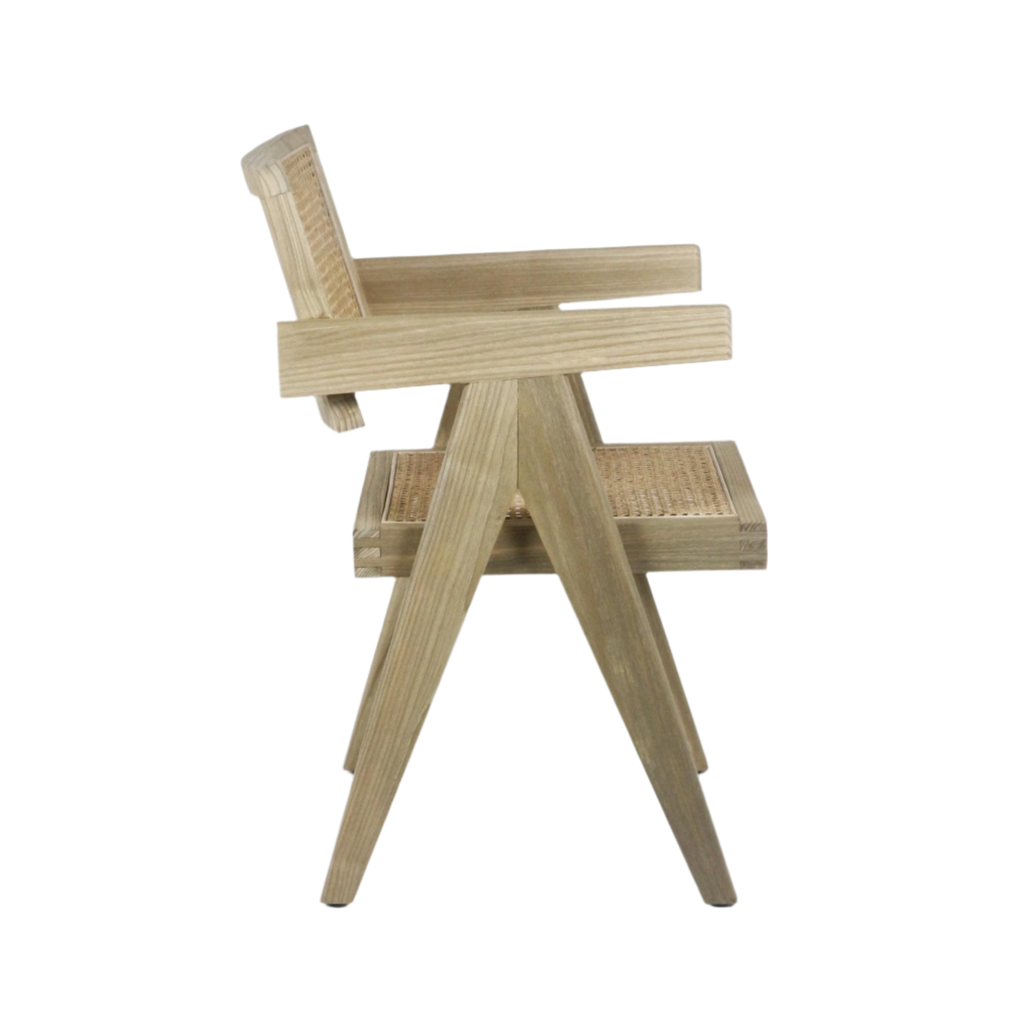 Side profile of a mid-century modern dining chair in natural teak wood with woven cane seat and back, wide rectangular armrests and angled A-frame legs.