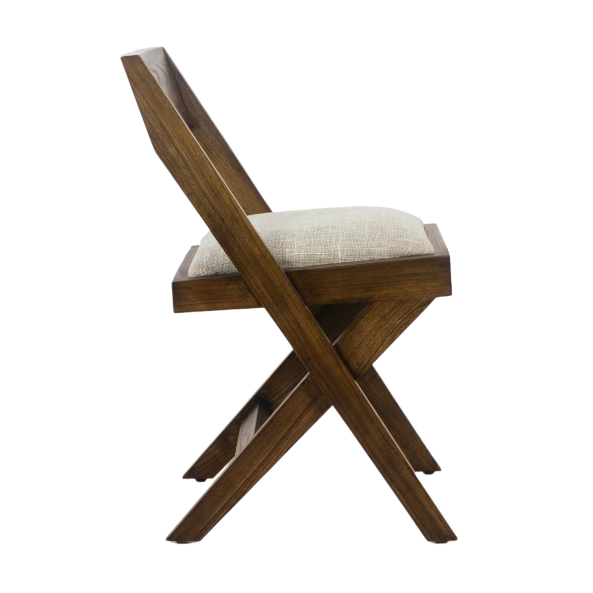 Side view of a mid-century modern x-frame dining chair in warm teak wood with a textured beige upholstered cushion and angled backrest.