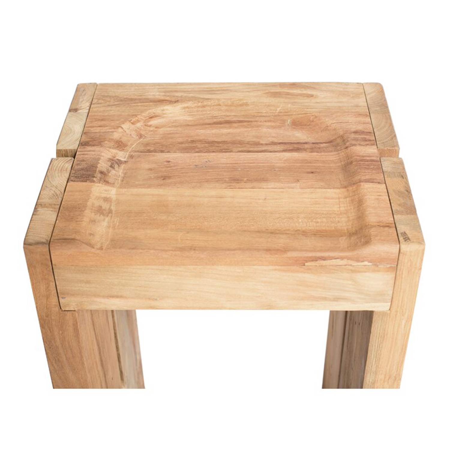 Top-down close-up of a backless teak outdoor bar stool in a natural finish, showing the carved concave seat, square top edges and thick legs with warm teak wood grain.