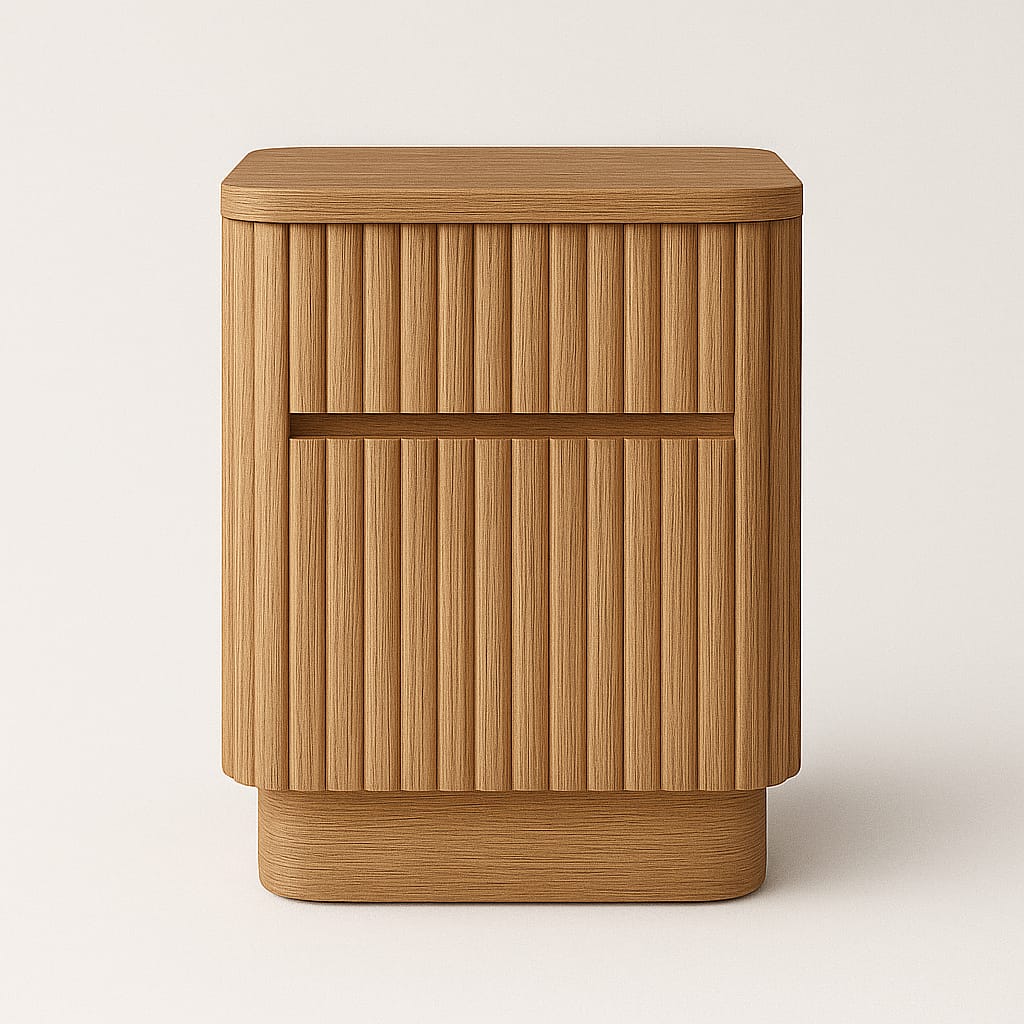 Front-facing studio photo of a natural oak fluted nightstand with two drawers, rounded edges and vertical ribbed detailing in a modern mid-century style on a neutral background.
