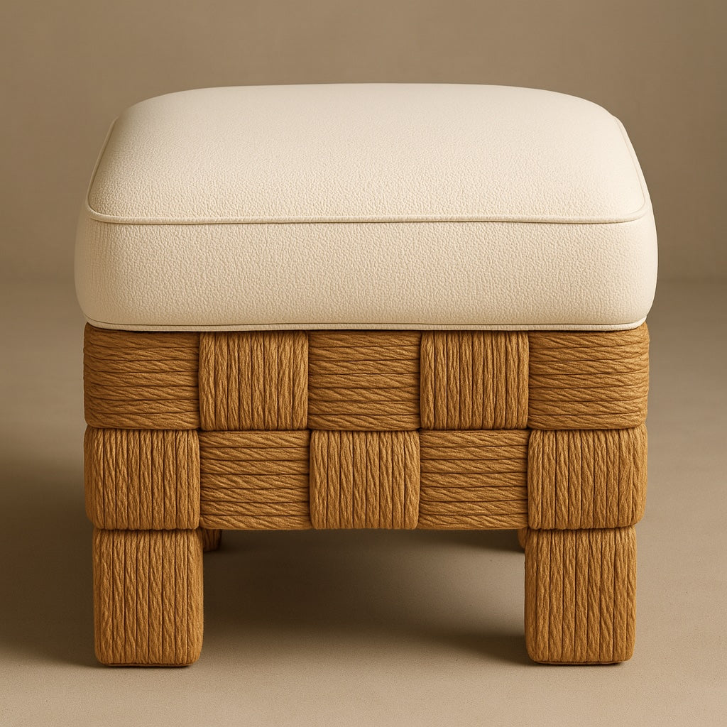Front view of a small square vanity footstool with a cream boucle cushion and piped edge resting on a woven natural rattan and sisal-wrapped tan base with block legs.
