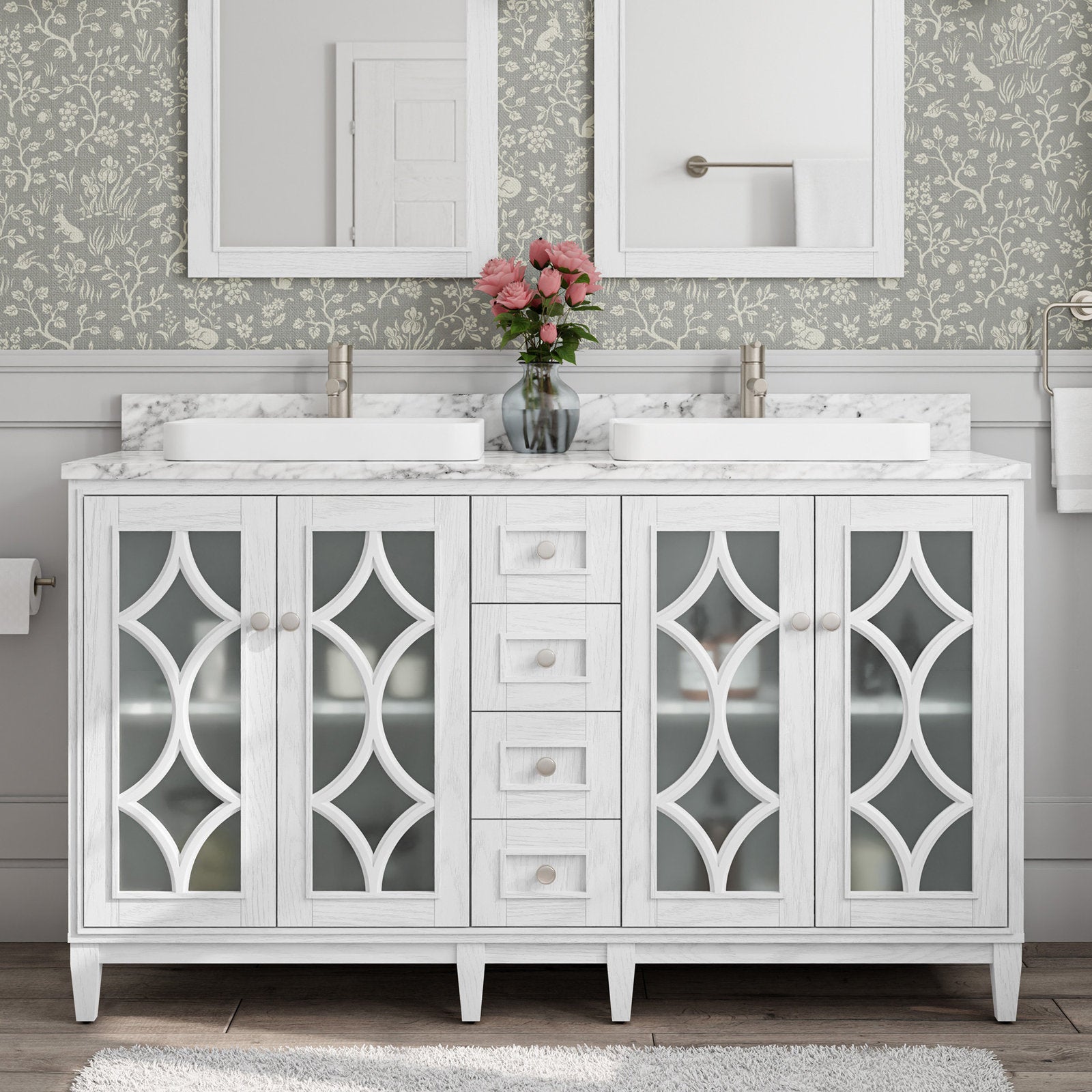 Stone-top white solid-wood 60-inch double-sink bathroom vanity with marble-look countertop, two rectangular white vessel sinks, brushed-nickel faucets, decorative frosted-glass cabinet doors, center drawers and a vase of pink flowers.
