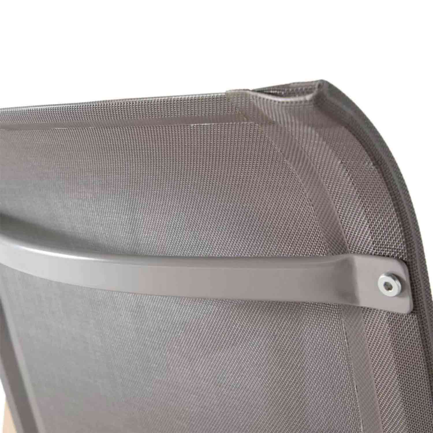 Close-up of a teak outdoor bar stool's gray mesh back panel with a curved metal support bar and exposed screw, coastal-style seating detail.