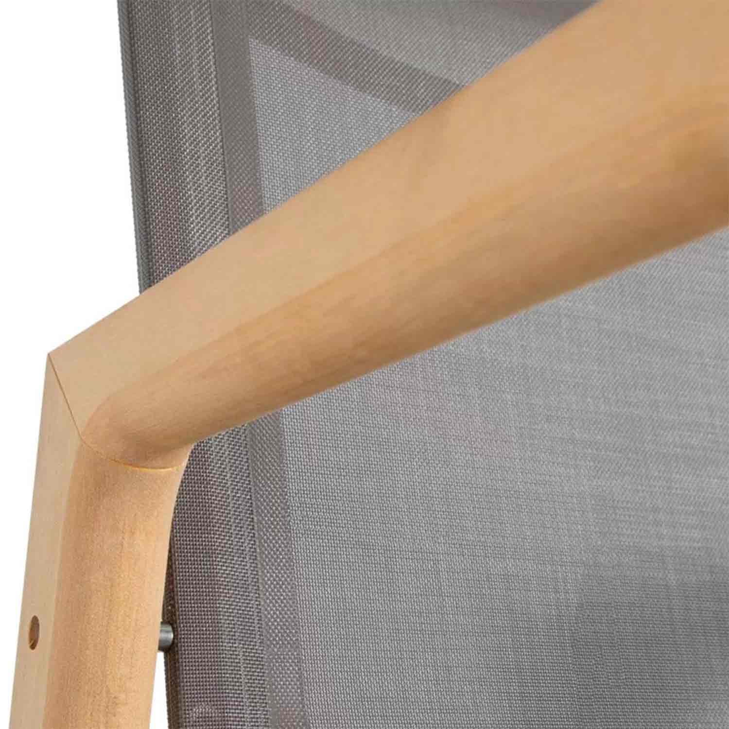 Close-up of a natural teak armrest and frame joined to a grey outdoor mesh back panel, showing smooth rounded joinery and a visible metal fastener.
