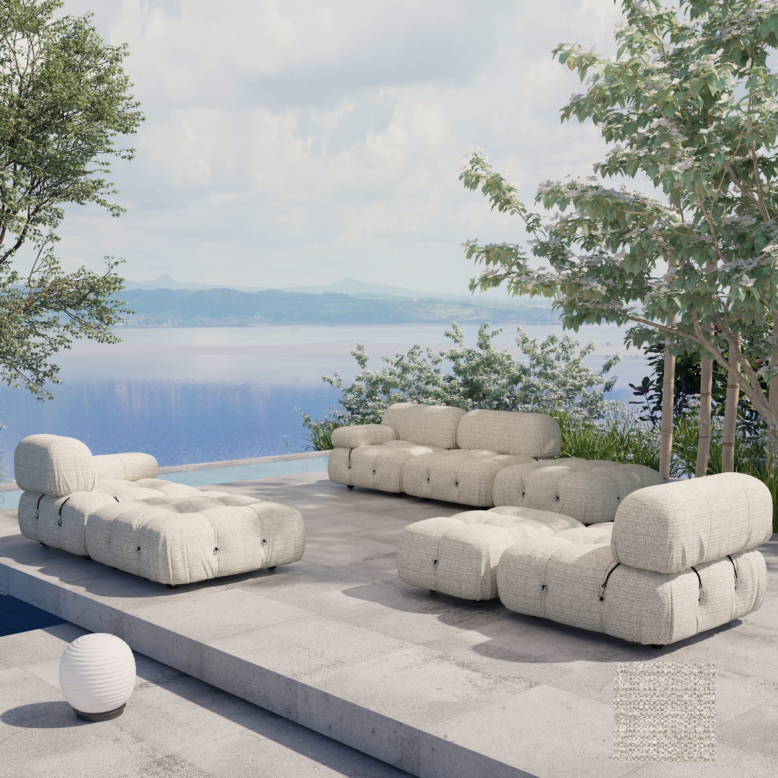 Coastal-modern outdoor modular sofa set in light beige textured fabric with tufted rounded cushions and adjustable backrests, shown as sectional pieces and ottomans on a concrete patio by the water and trees.