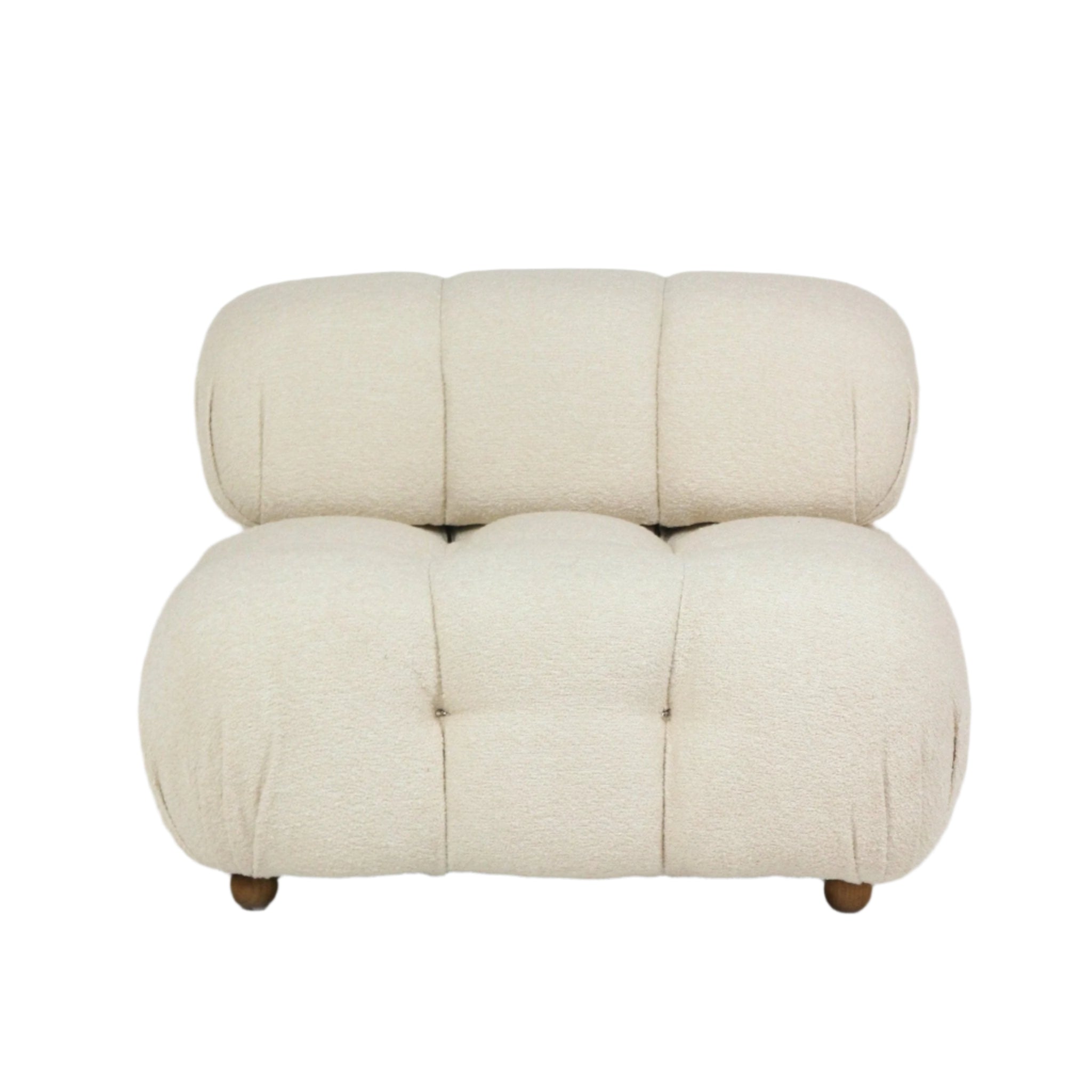 Cream boucle upholstered sofa with rounded tufted seat and back, low-profile armless silhouette and short wooden legs for a modern living room.