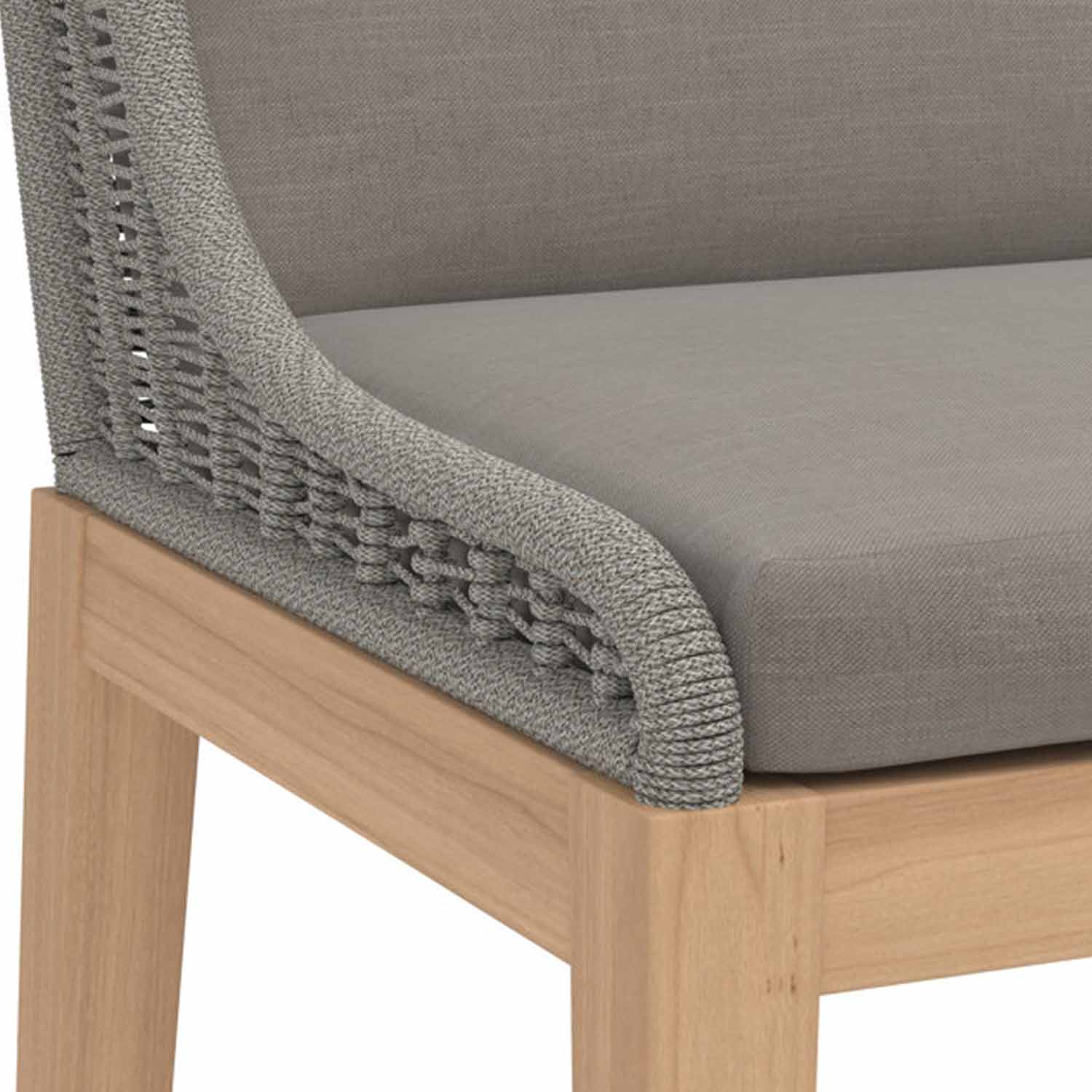 Close-up of an armless outdoor bar stool corner showing a light teak wood frame, grey upholstered seat cushion and woven grey rope back detail.