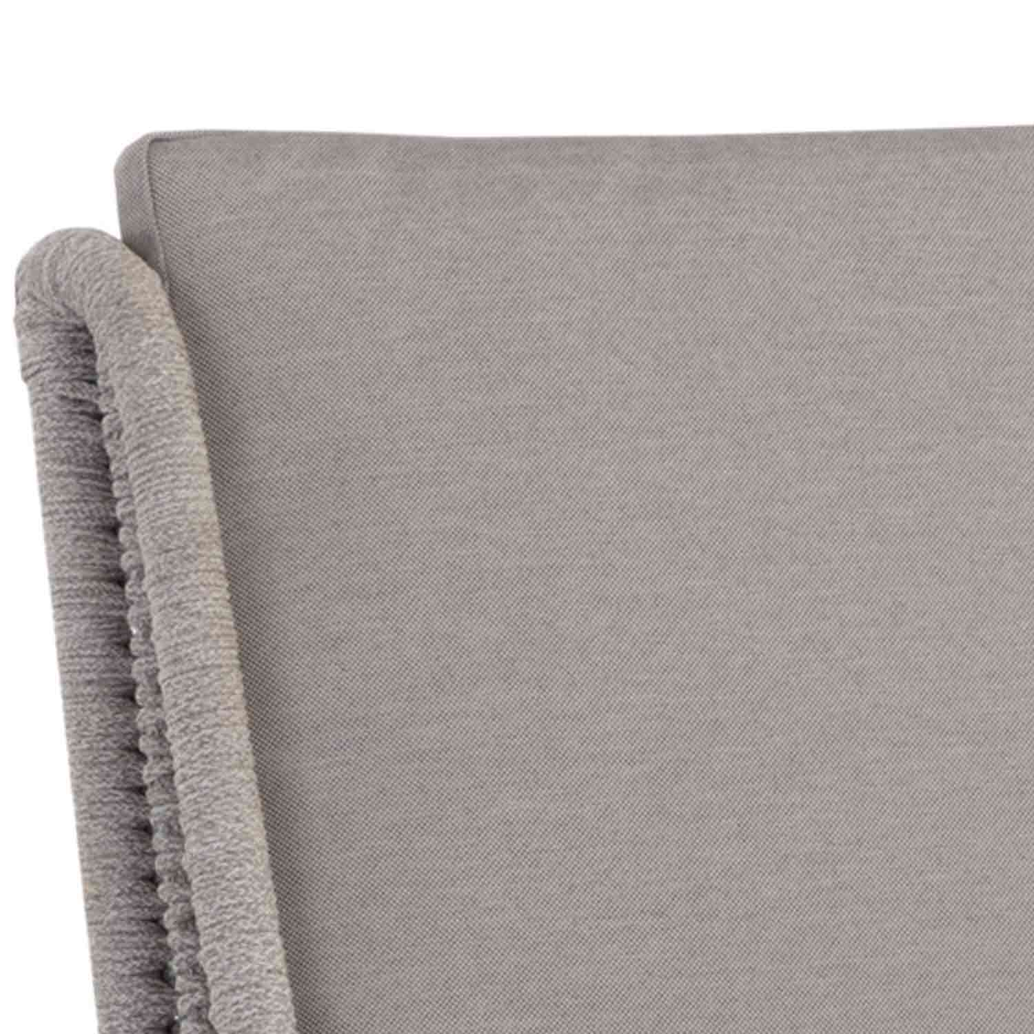 Close-up of a light grey upholstered bar stool backrest showing textured fabric and a rope-wrapped outer edge, part of a coastal teak outdoor stool.