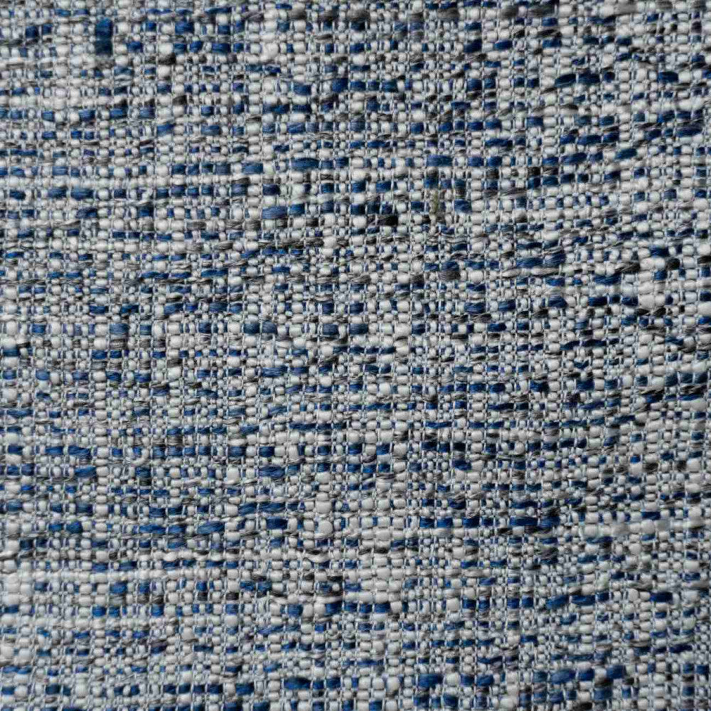 Close-up of gray boucle upholstery showing a nubby, woven texture with blue and charcoal flecks, highlighting the fabric used on a modern dining chair.