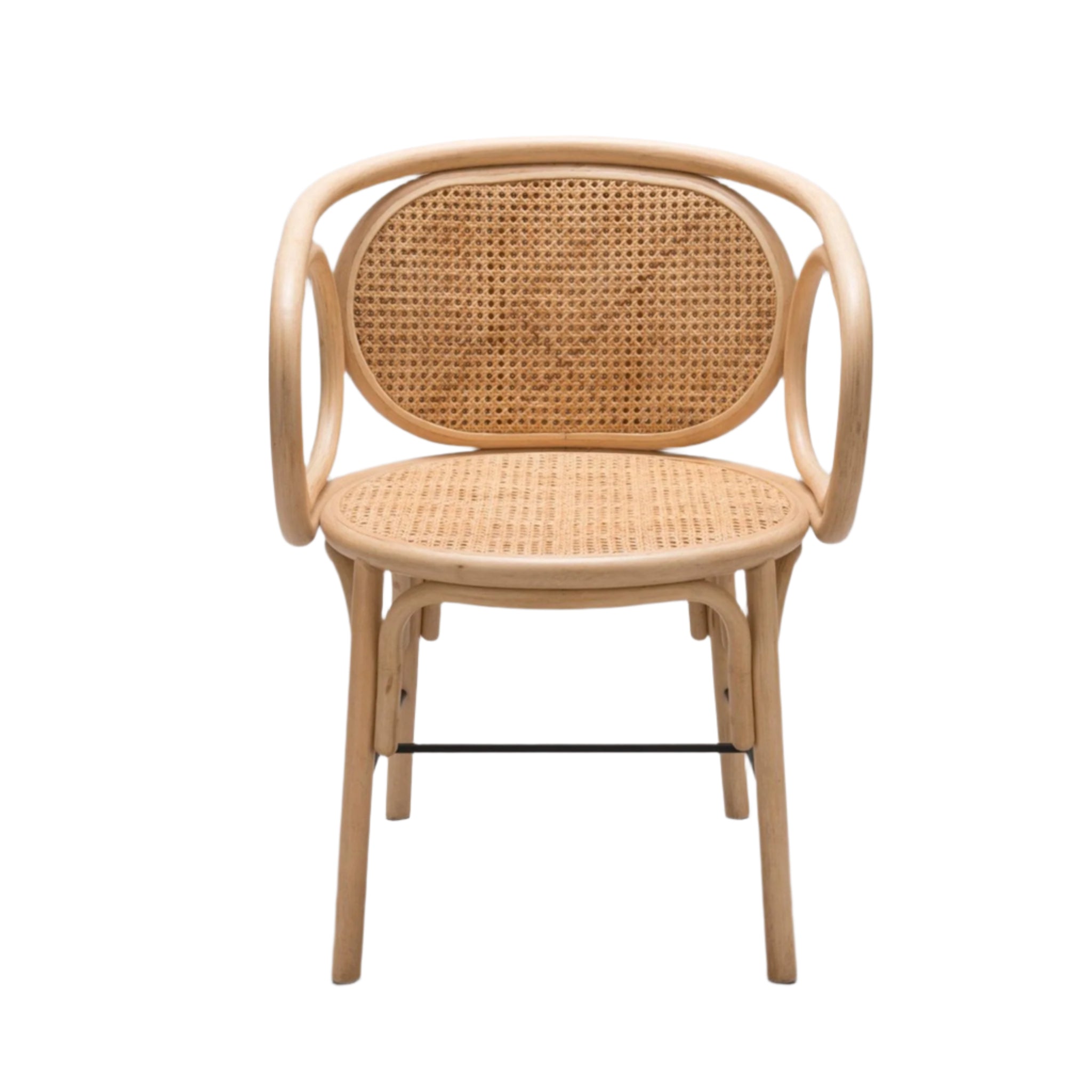 Front view of a natural rattan dining chair with a rounded natural wood frame, woven cane seat and oval cane back, curved arms and a black metal stretcher for support, boho-style seating.