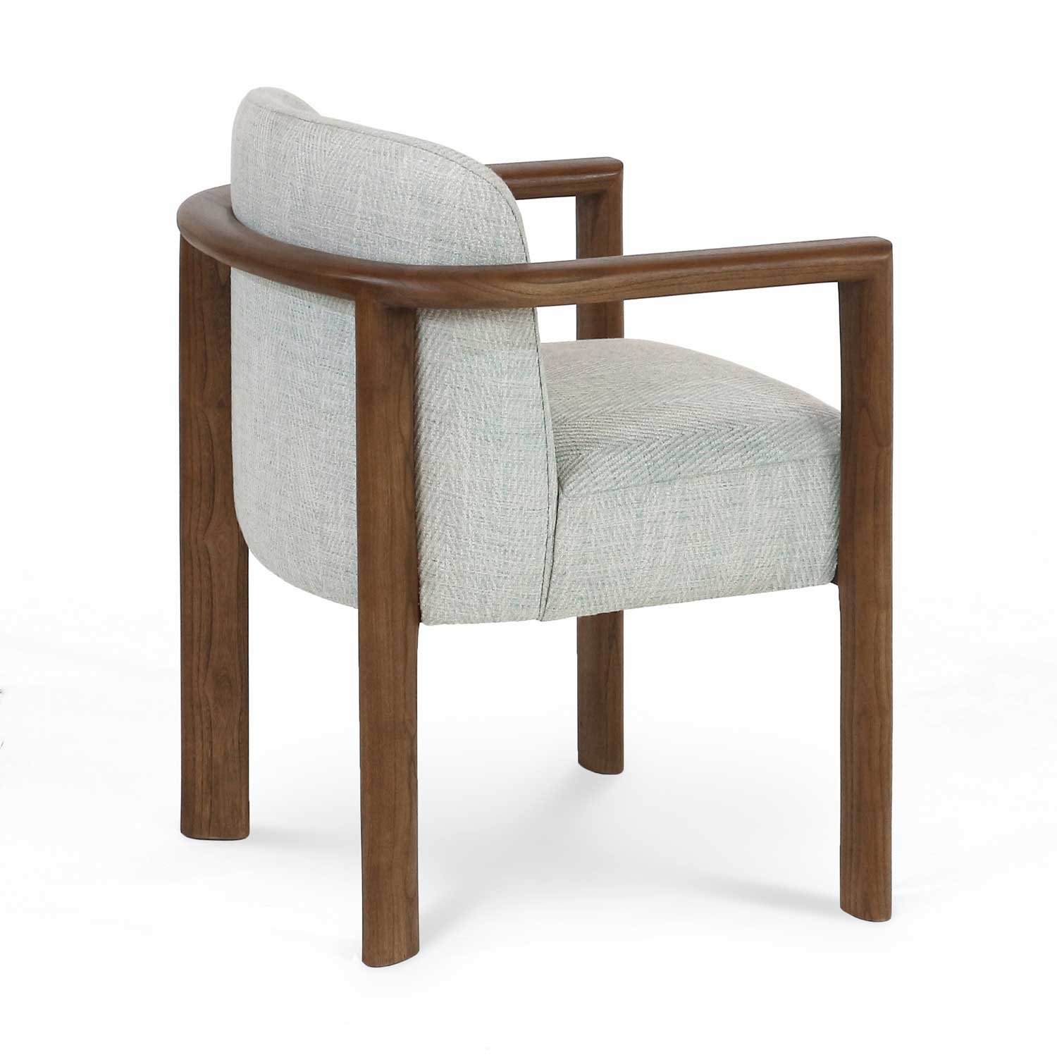 Three-quarter rear view of a modern dining chair upholstered in light gray herringbone fabric with a curved oak wood frame, squared oak armrests and round oak legs.
