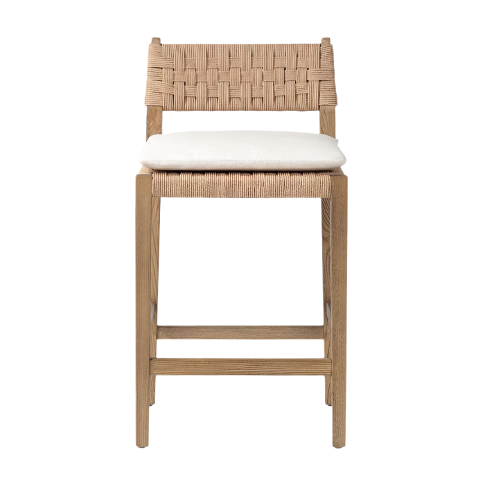Front view of a modern counter stool in natural oak with woven papercord back and seat, square legs with a footrest and a removable cream seat cushion.