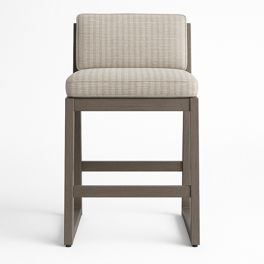Front view of an armless teak outdoor bar stool with a beige textured fabric seat and low upholstered back, rectangular teak frame and horizontal footrest in a contemporary coastal style.