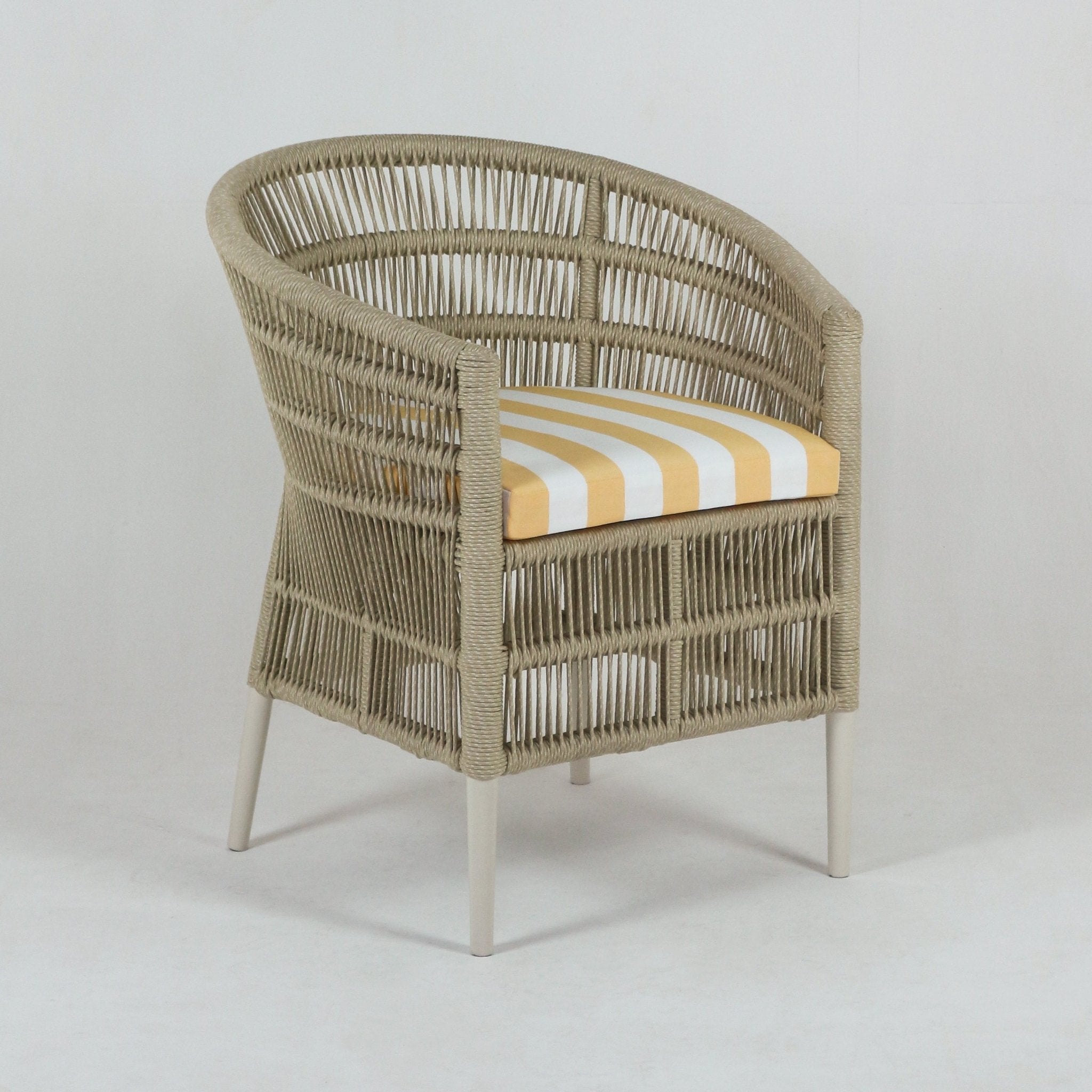 Beige rope-woven coastal patio armchair with rounded back, cream metal legs and a yellow-and-white striped outdoor fabric seat cushion.
