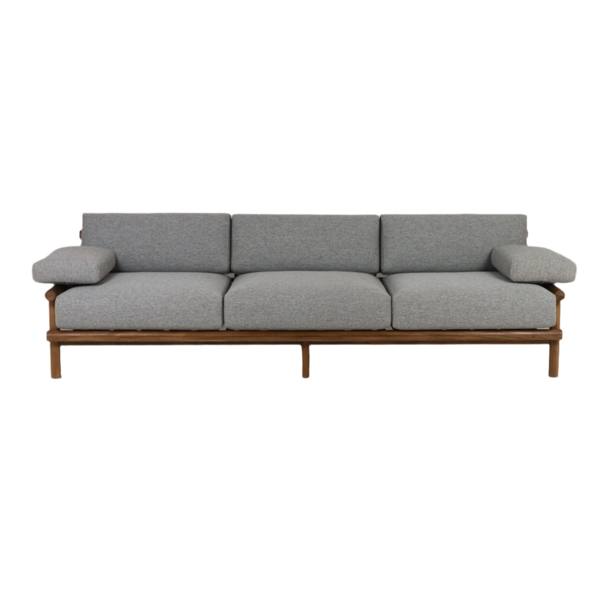 Three-seat outdoor sofa with a natural teak wood frame and gray Sunbrella fabric cushions, low-profile coastal-modern silhouette with padded armrests and raised legs.