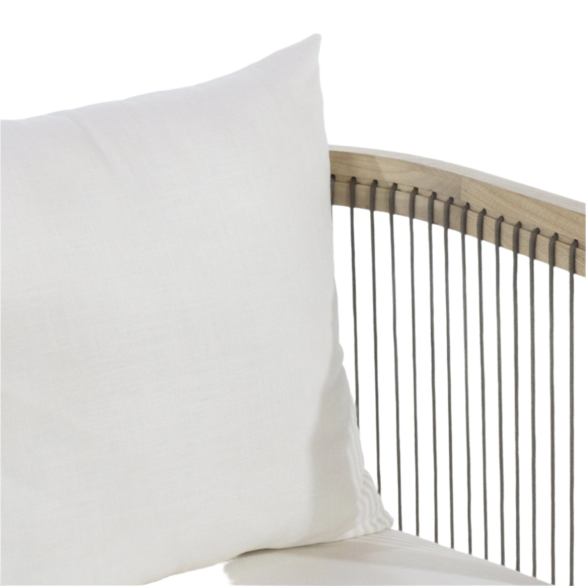 White fabric seat cushion and pillow on a dining chair with a curved natural wood back framed by vertical grey rope cords, shown in a close-up detail of the modern Scandinavian-style design.