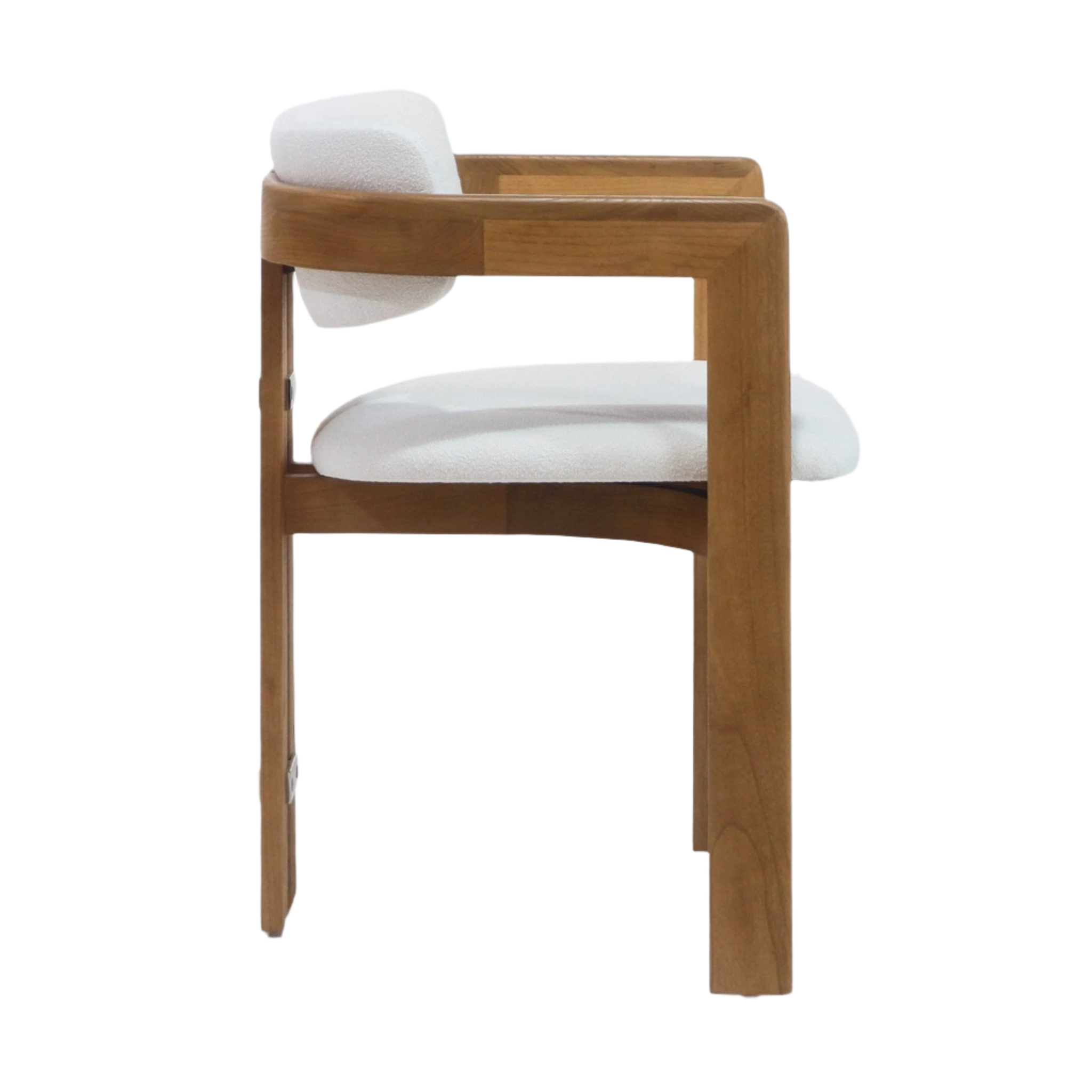 Side profile of a dining chair with a natural teak wood frame, curved armrests and a white boucle-upholstered seat and low back in a mid-century modern silhouette.