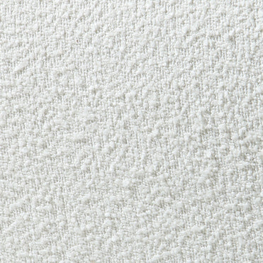 Close-up of white boucle upholstery fabric showing soft nubby looped texture, ideal for mid-century modern dining chairs.