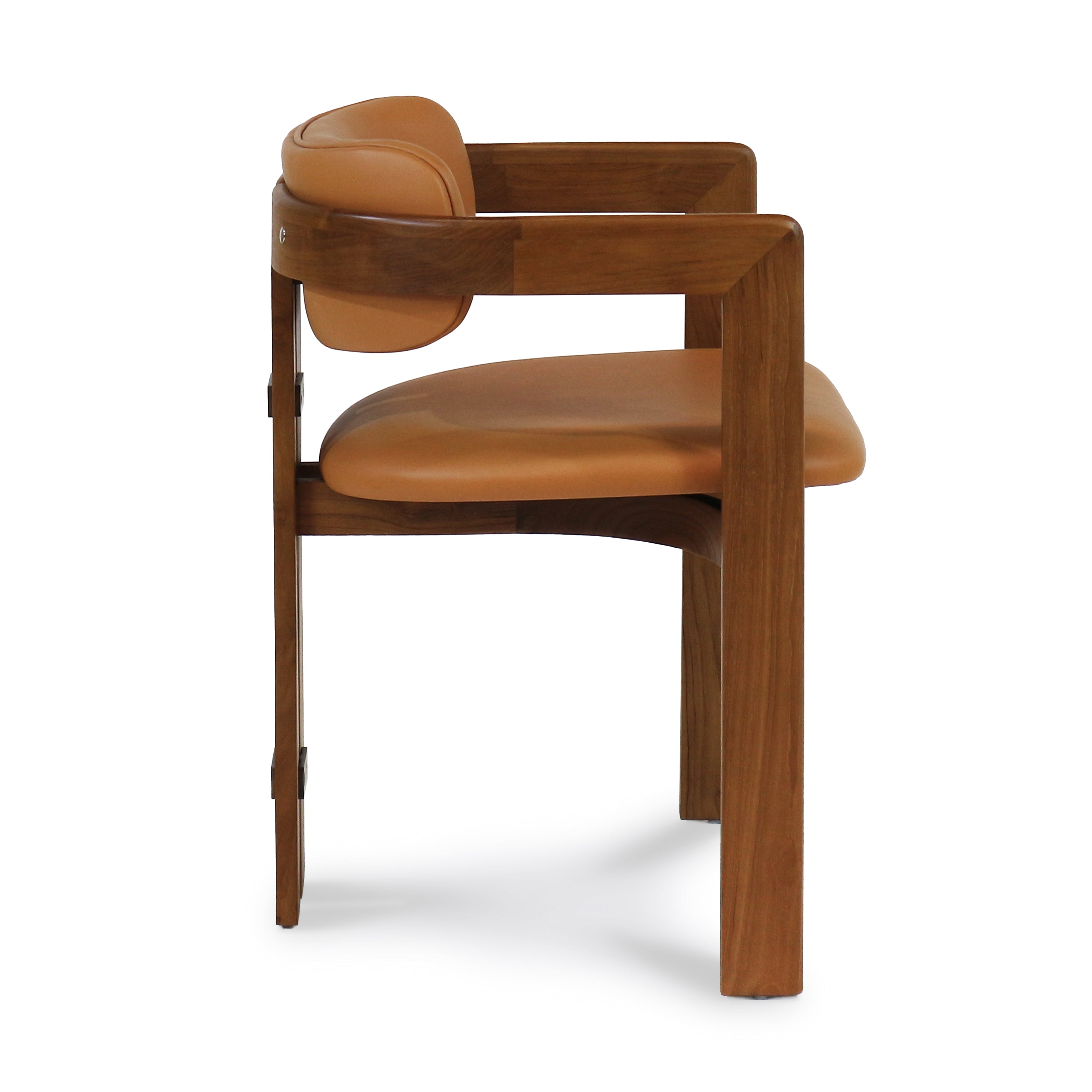 Side view of a mid-century modern walnut dining chair with tan nubuck leather seat and curved backrest on a solid walnut frame with squared legs.