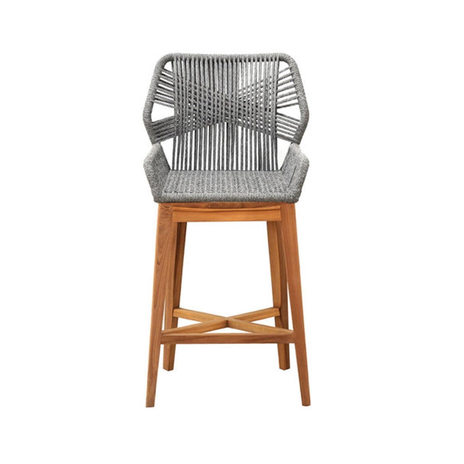 Outdoor bar stool with a natural teak frame and grey woven rope seat and back, angled teak legs with an X-shaped cross stretcher and short arms in a coastal-contemporary style.