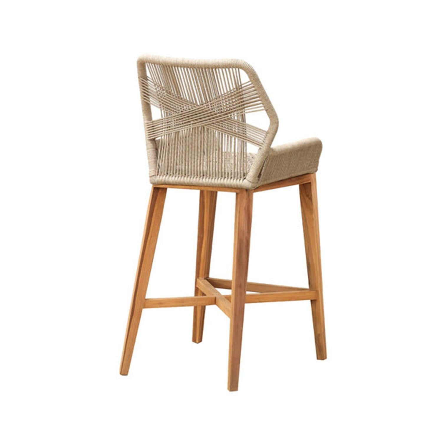 Counter-height teak bar stool with natural wood legs, woven beige rope back in an X pattern, padded natural seat and wooden crossbar footrest, shown at a three-quarter rear angle for coastal outdoor seating.