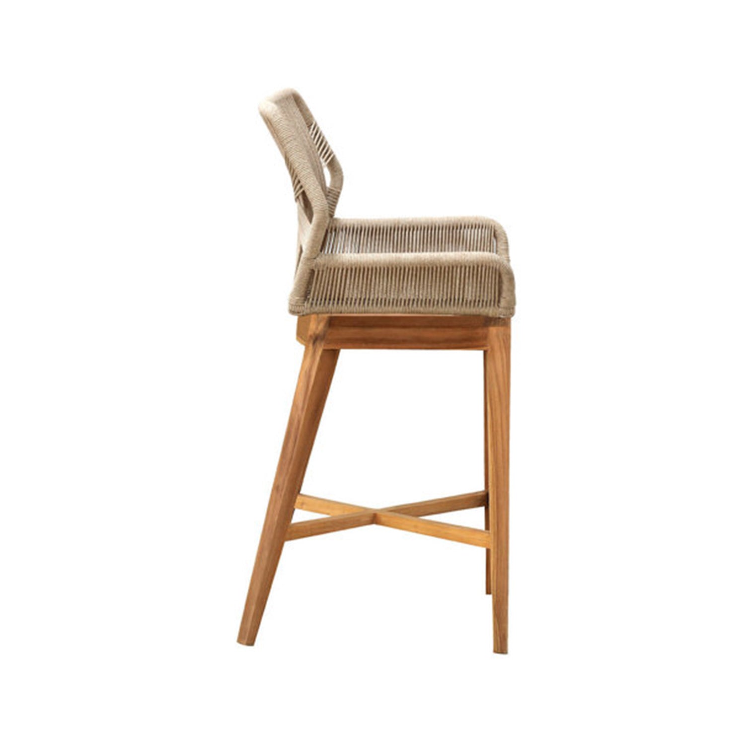 Side view of a counter-height outdoor bar stool with a natural teak wood frame, tapered legs and crossed stretcher footrest, featuring a woven natural-beige rope seat and low back in a coastal contemporary style.