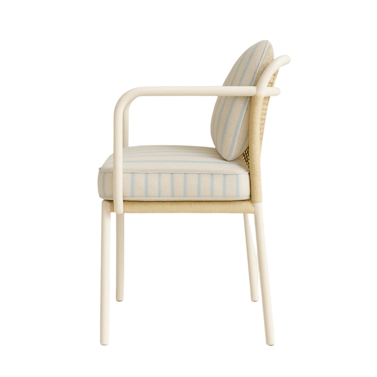 Side view of a coastal-style patio dining chair with a white aluminum frame and slim arms, woven synthetic cane back, and cream fabric seat and back cushions with pale blue stripes.