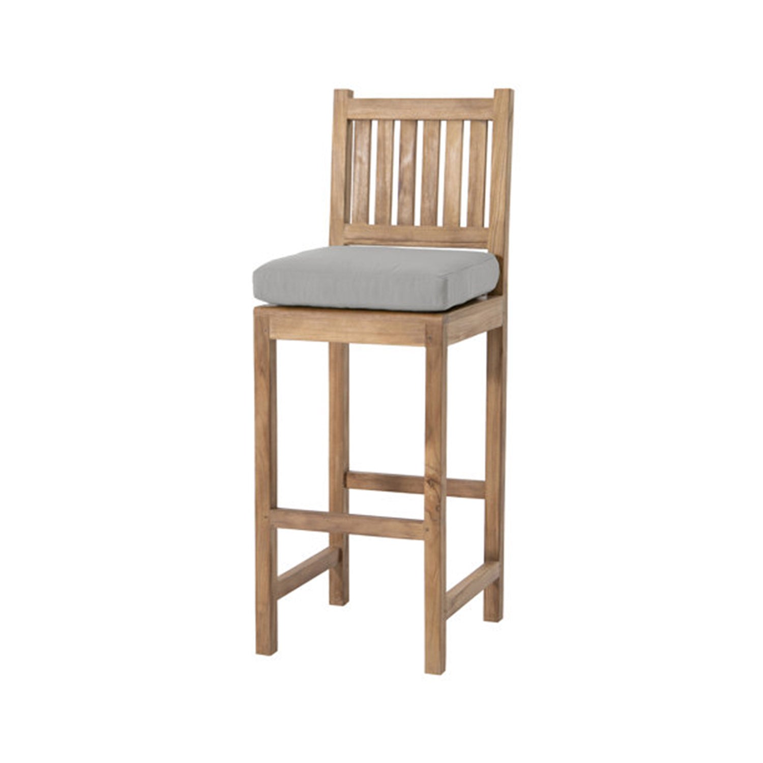 Armless teak outdoor bar stool with slatted back and natural teak finish, square legs and built-in footrest, topped with a light gray upholstered seat cushion for coastal-style counter-height seating.