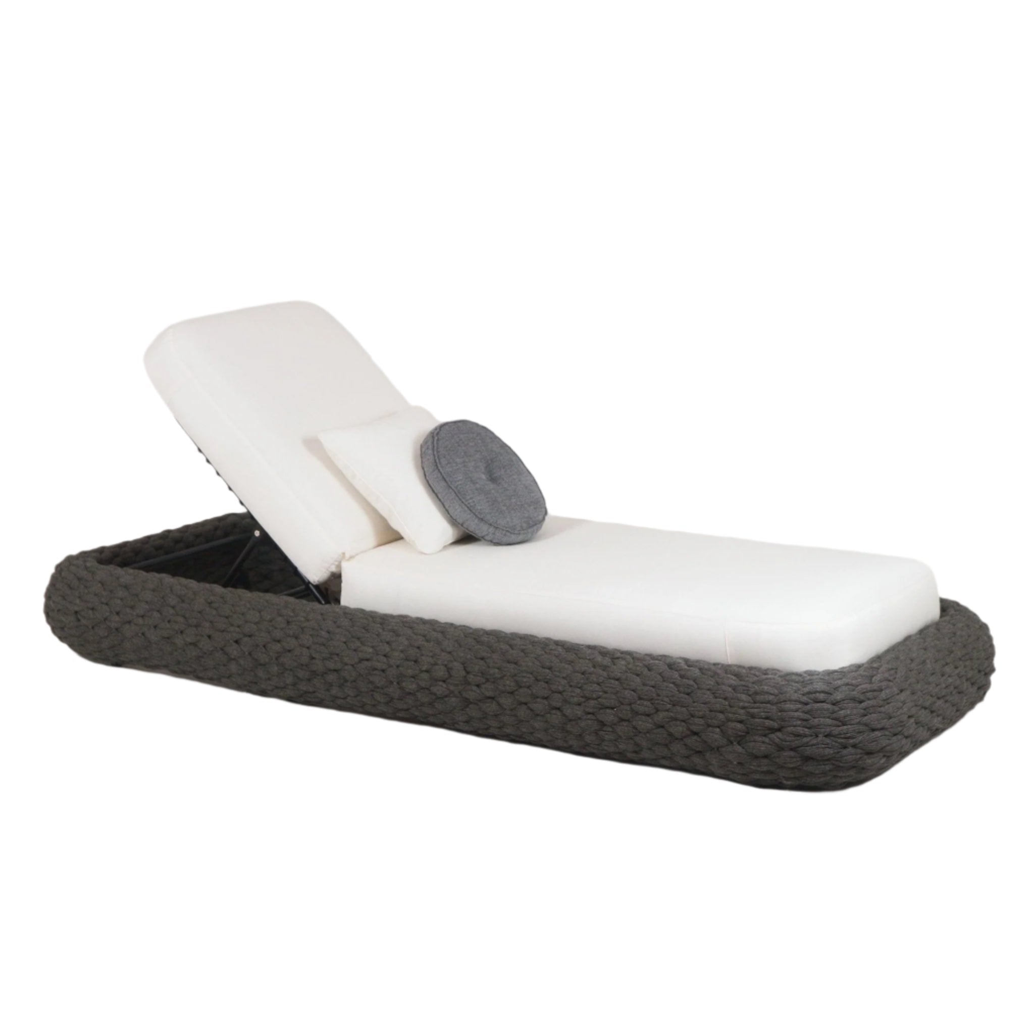Poolside coastal chaise with a taupe rope-woven base, white fabric cushioned mattress and adjustable metal backrest, shown with a round gray accent pillow and a small white lumbar pillow.