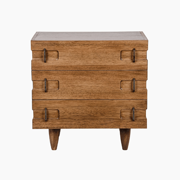 Front view of a solid oak three-drawer nightstand in a natural oak finish with slim antique brass pull handles, recessed drawer cutouts and tapered legs.