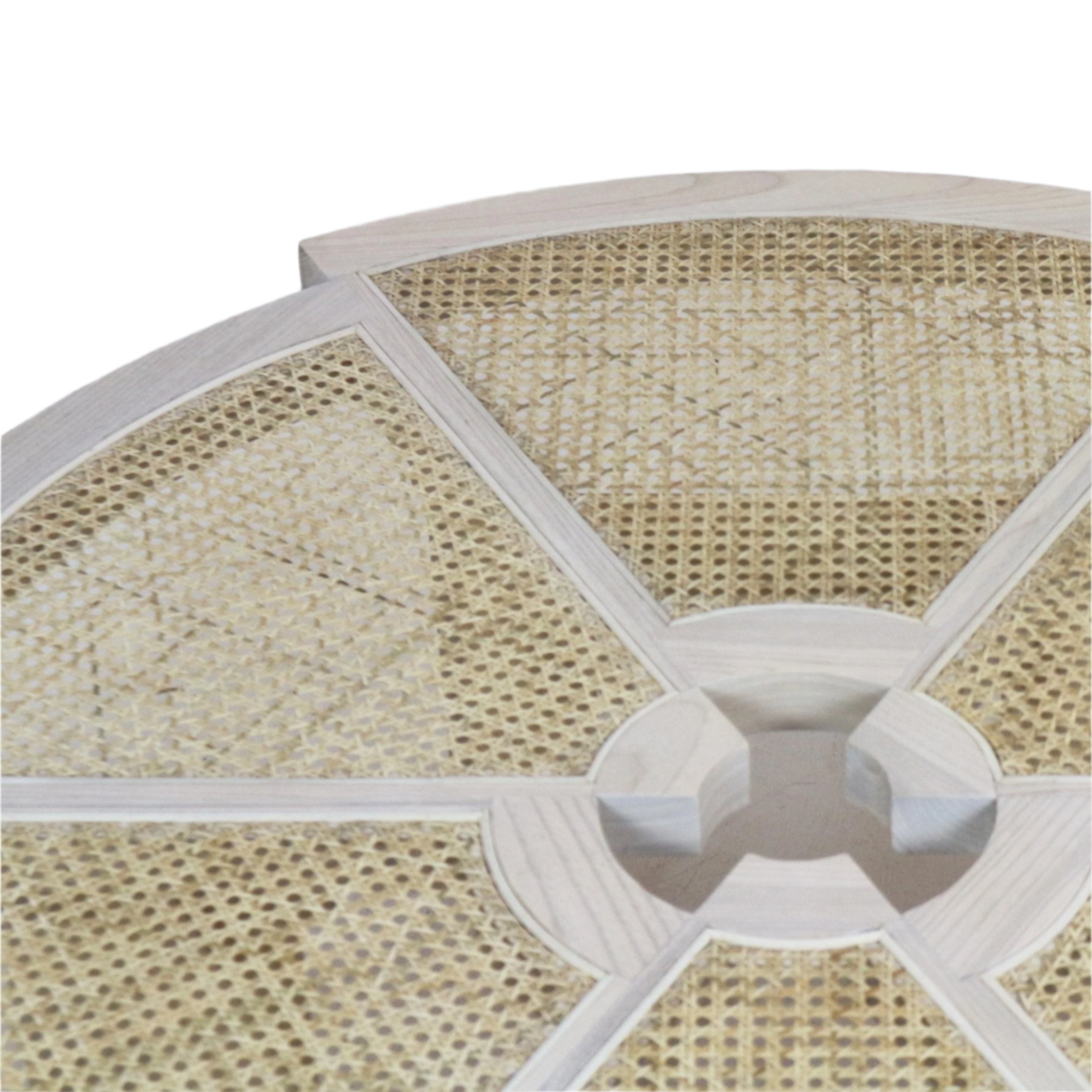 Close-up of a round coffee table top showing a pale natural solid wood frame with radial spokes, woven beige cane panels, and a central circular cutout detail.