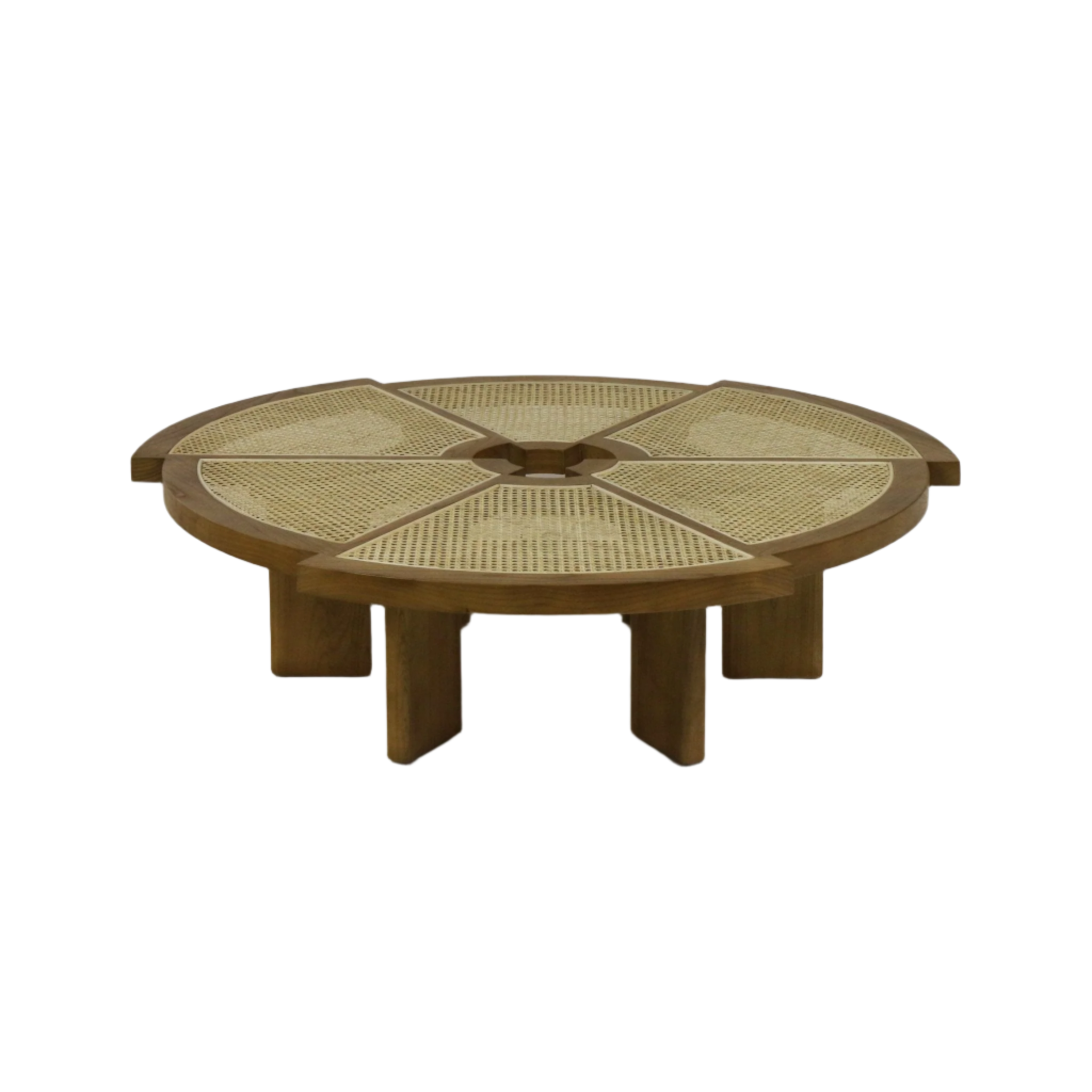 Round coffee table in natural solid wood with a cane-woven top divided into six wedge panels and a small central cutout, resting low on chunky modern-style legs.