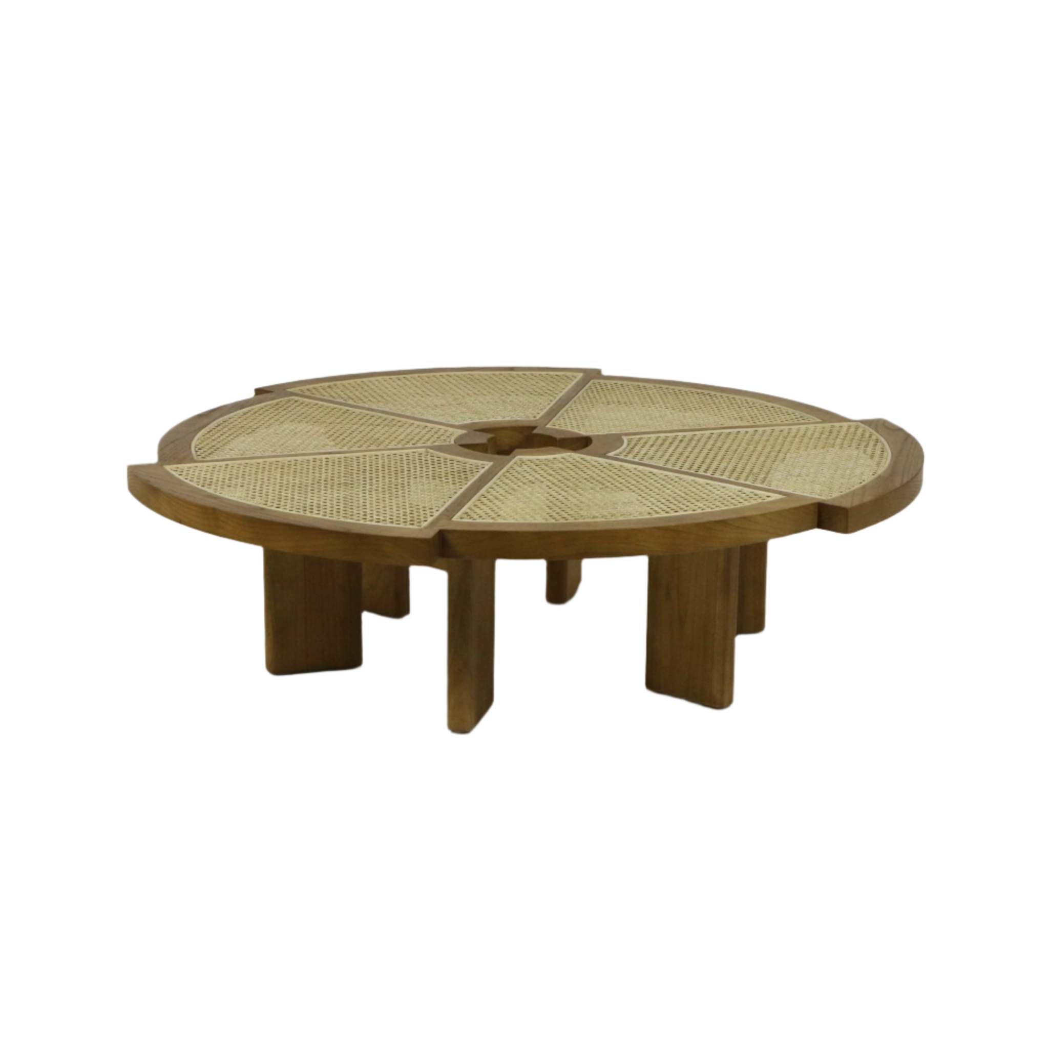 Low round coffee table with a natural wood frame and woven cane top divided into six wedge panels around a small central circular opening, supported by chunky intersecting solid wood legs in a light teak finish.