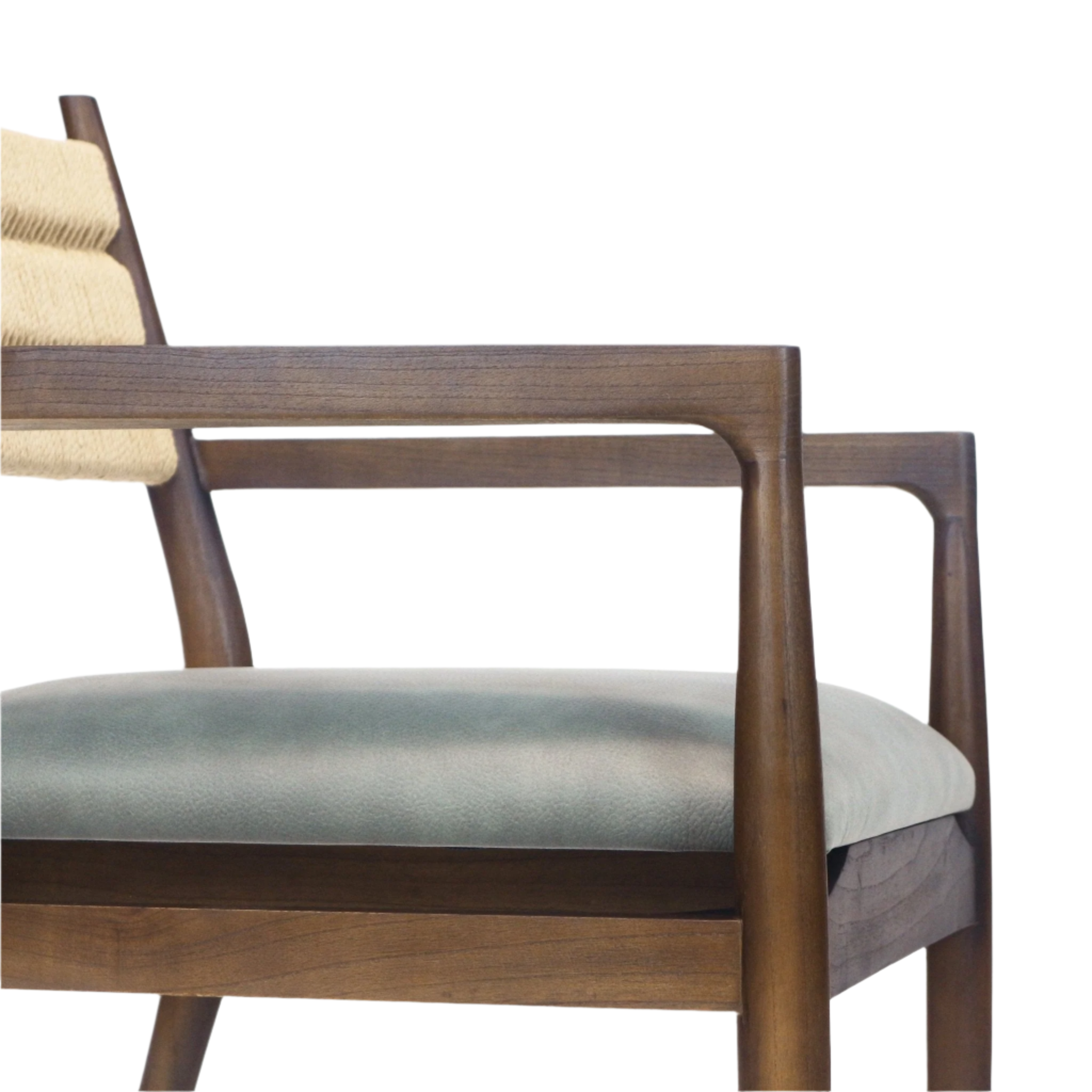 Close-up of a dining chair showing the walnut-finish solid wood arm and frame, tan woven rope backrest and a padded blue leather seat cushion.