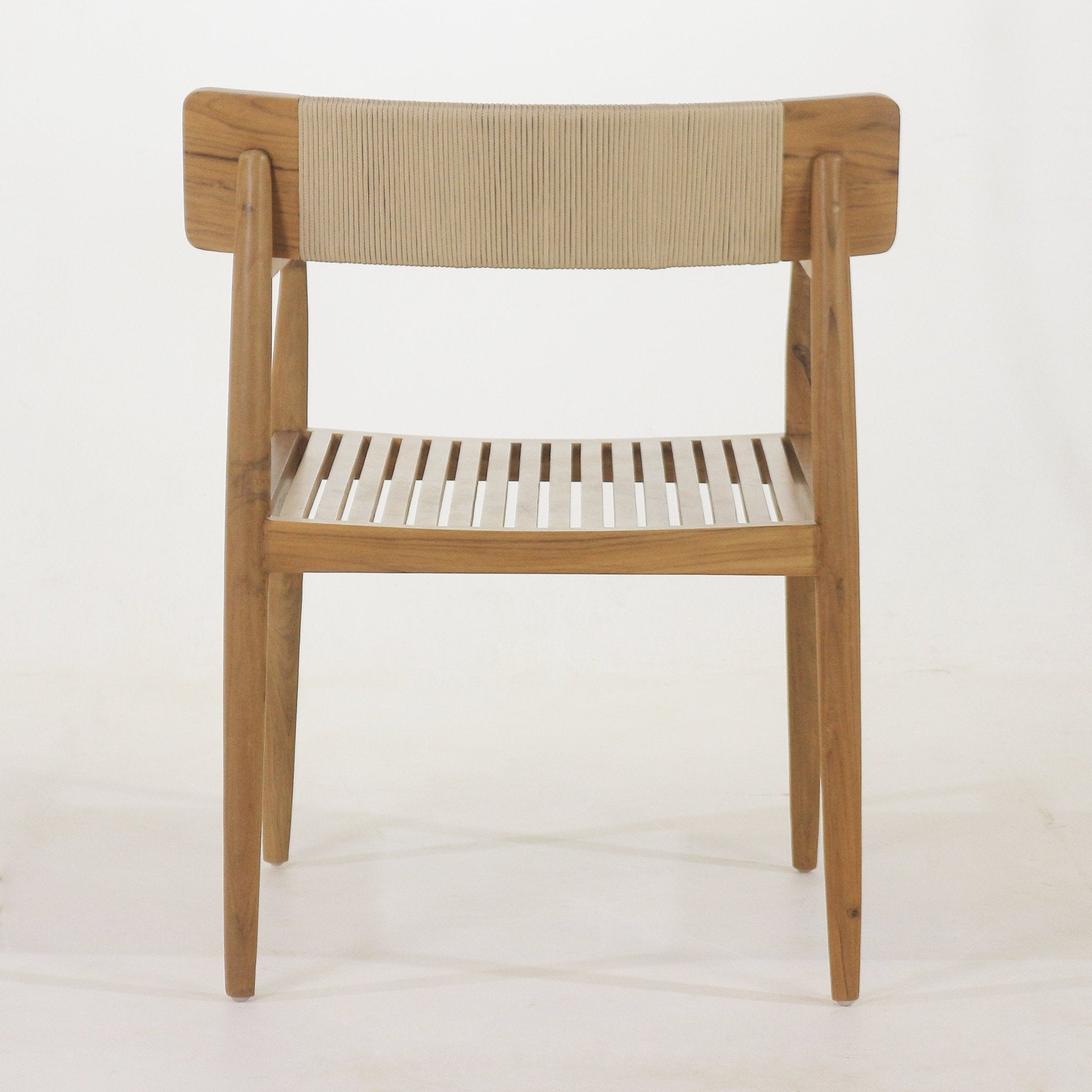 Front view of a natural teak outdoor dining chair with a slatted wooden seat, tapered legs, angled arms and a beige woven rope backrest.