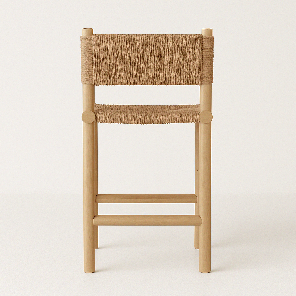 Front view of an armless natural teak outdoor bar stool with woven natural rope seat and back, round teak legs and two front footrests, shown against a neutral background.