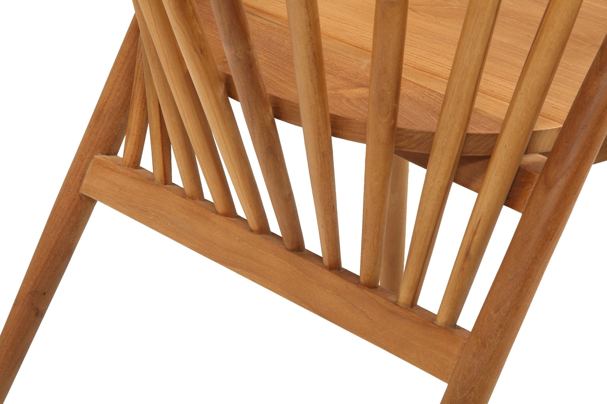 Close-up of a natural teak solid-wood dining chair showing tapered spindles, angled leg and contoured seat edge in a mid-century modern, Shaker-inspired style.